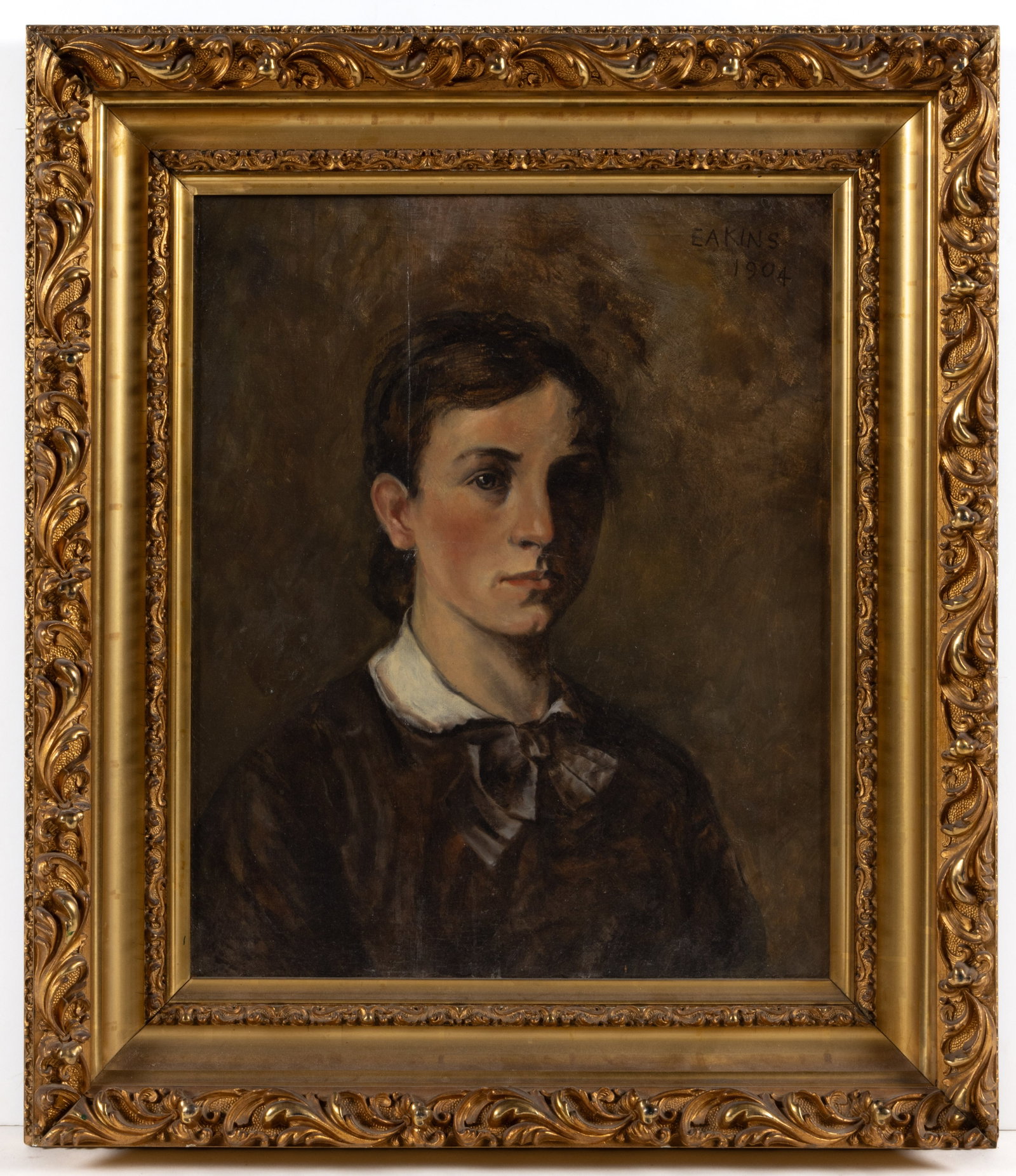 THOMAS COWPERTHWAIT EAKINS (AMERICAN, 1844-1916), SCHOOL OF / ATTRIBUTED, PORTRAIT OF A YOUNG LADY: THOMAS COWPERTHWAIT EAKINS (AMERICAN, 1844-1916), SCHOOL OF / ATTRIBUTED, PORTRAIT OF A YOUNG LADY, oil on canvas, a bust length depiction of a young lady with her hair pulled back and a bow around he