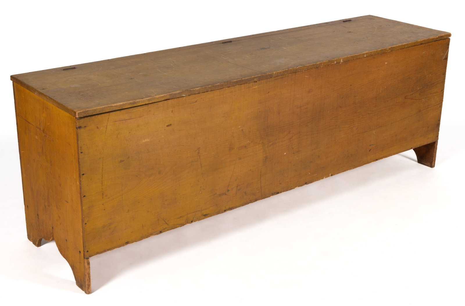 AMERICAN PAINTED PINE STORAGE CHEST: AMERICAN PAINTED PINE STORAGE CHEST, the large rectangular six-board form of nailed construction with hinged lid concealing an open interior, solid ends terminating in cut-outs. Retains likely
