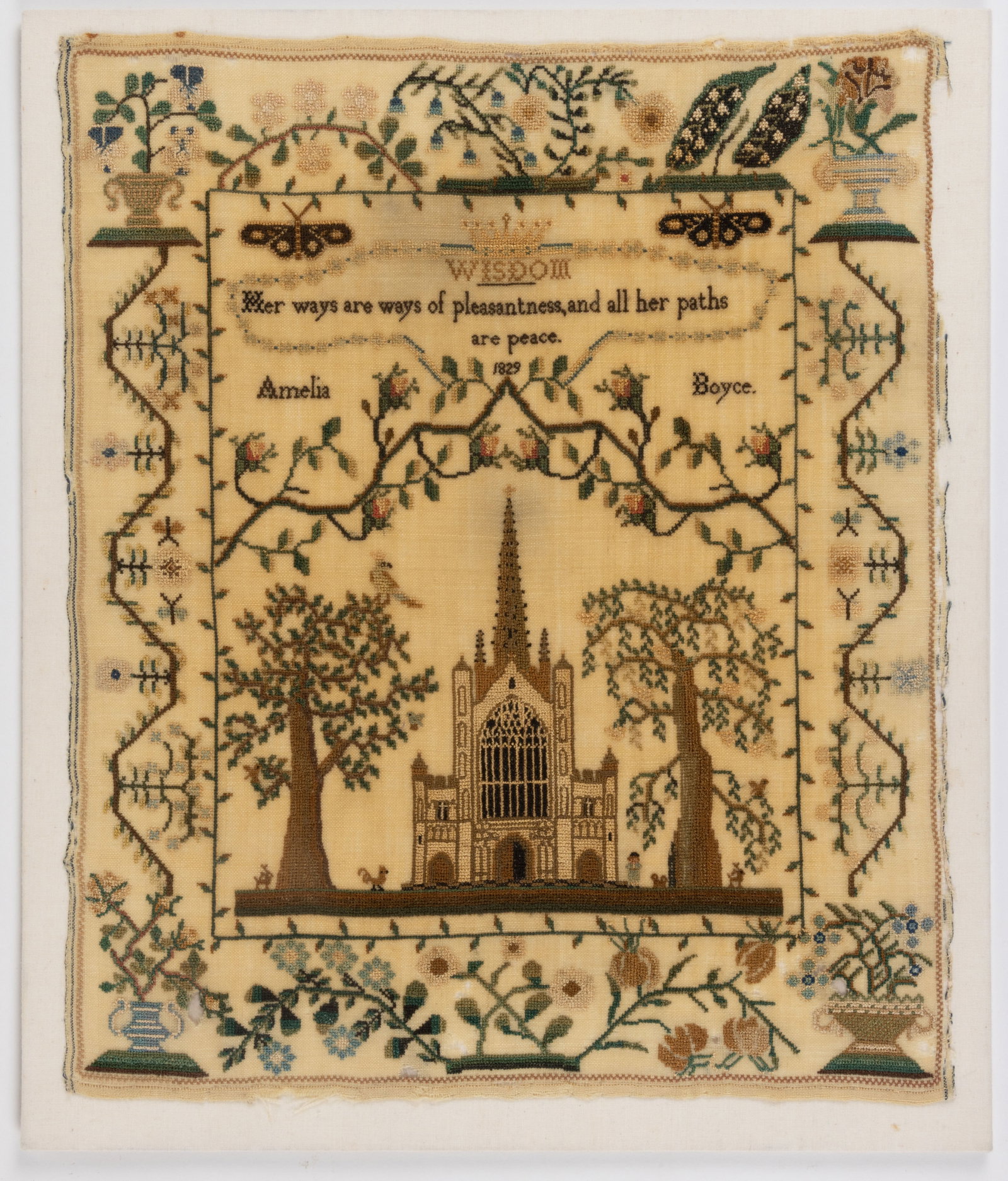 BRITISH PICTORIAL NEEDLEWORK SAMPLER: BRITISH PICTORIAL NEEDLEWORK SAMPLER, silk on linen, top with two butterflies and a central crown motif over an excerpt titled "WISDOM" from Proverbs chapter 3, verse 17, which reads,