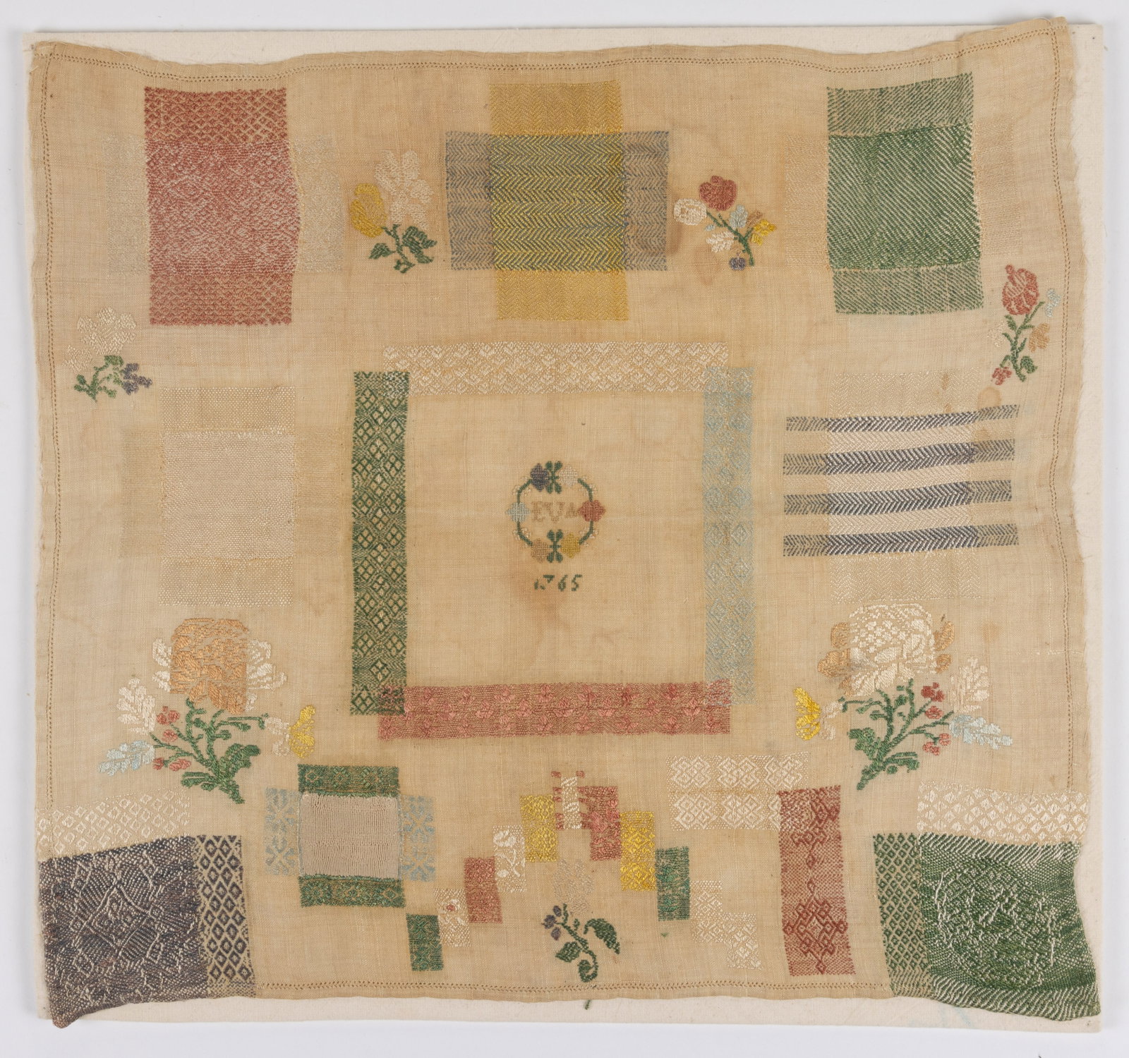 18TH CENTURY CONTINENTAL DARNING NEEDLEWORK SAMPLER: 18TH CENTURY CONTINENTAL DARNING NEEDLEWORK SAMPLER, silk on linen, center featuring "EVA" initials within a floral wreath above a date of "[17]65", encompassed by a darning