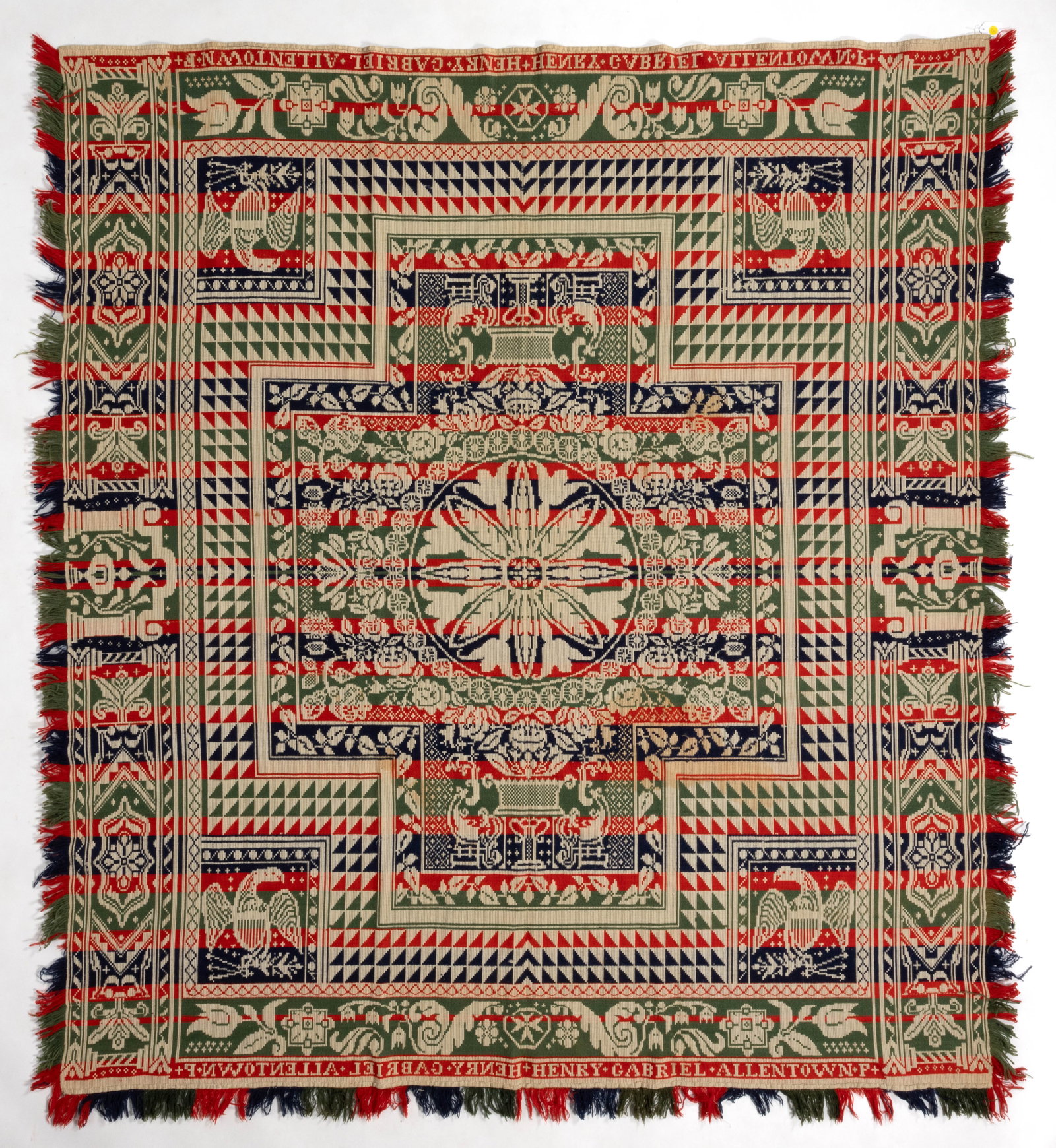 ALLENTOWN, PENNSYLVANIA SIGNED JACQUARD COVERLET: ALLENTOWN, PENNSYLVANIA SIGNED JACQUARD COVERLET, red, green, and dark blue wool, and light blue and natural cotton, whole panel, cross-form center reserve with a floral medallion surrounded by