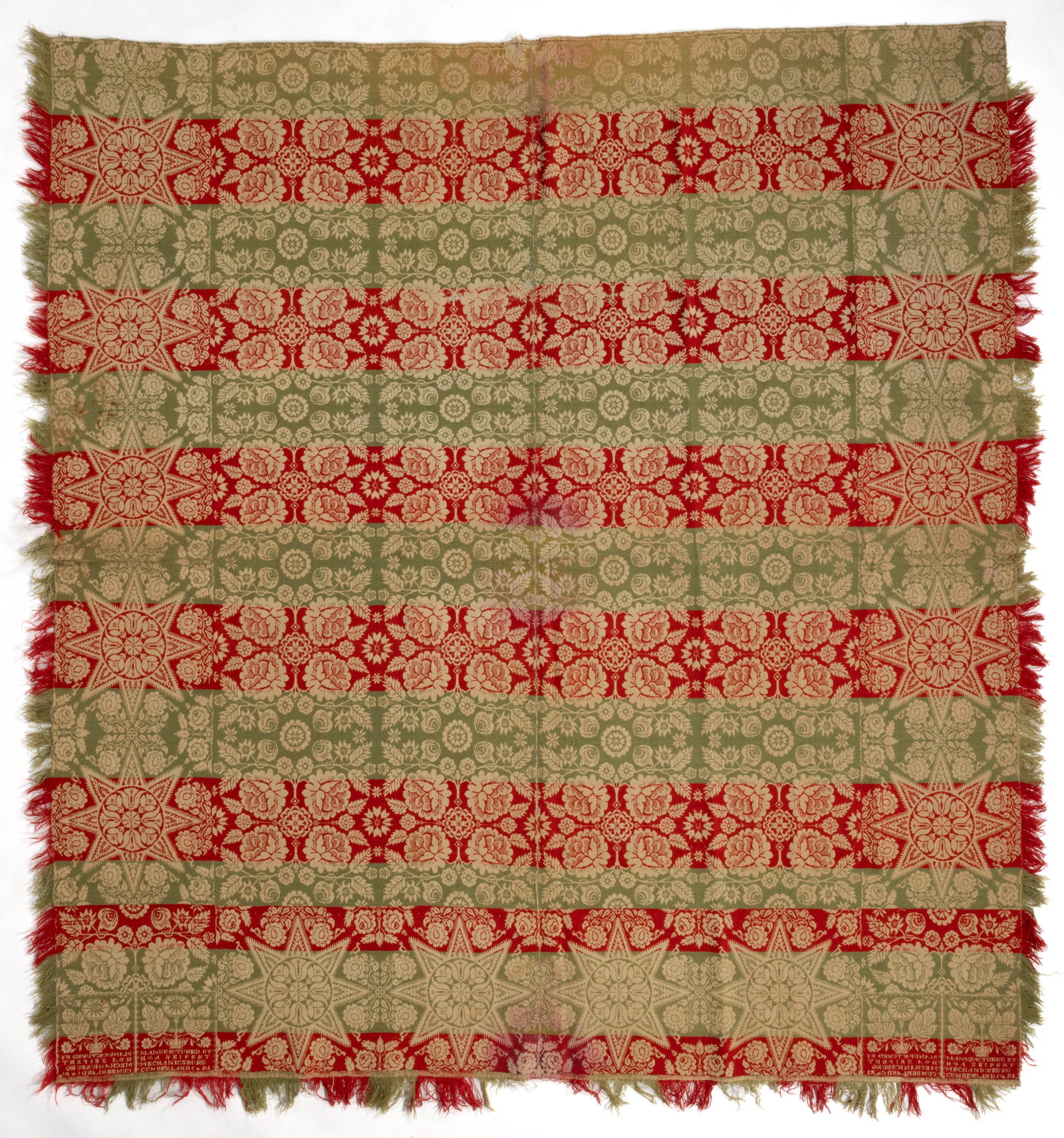 MECHANICSBURG, PENNSYLVANIA SIGNED AND DATED JACQUARD COVERLET: MECHANICSBURG, PENNSYLVANIA SIGNED AND DATED JACQUARD COVERLET, red and green wool, and light blue and natural cotton, two joined panels, center with repeated rose and flower design, three sides with