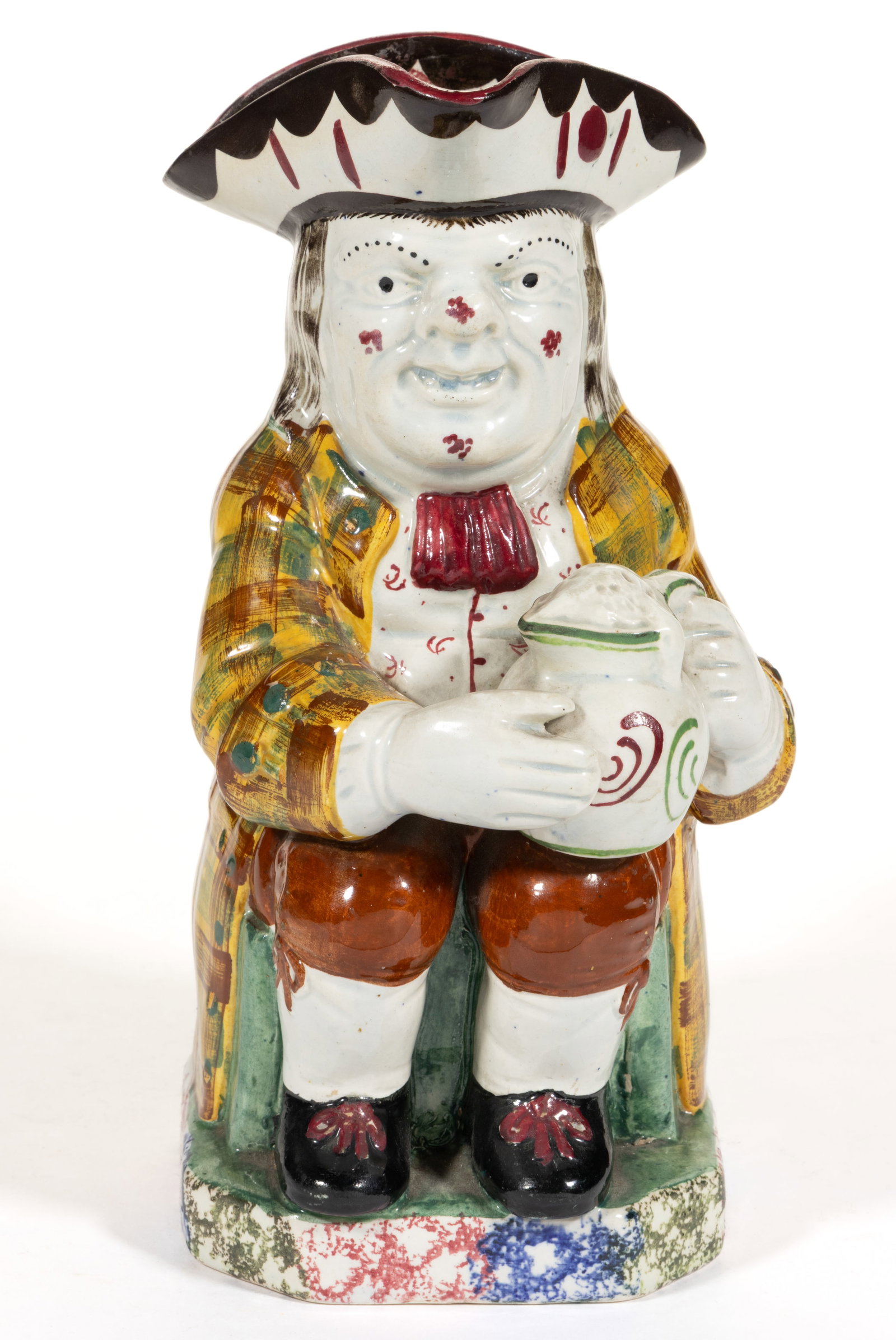 ENGLISH SIGNED NEALE & CO. PEARLWARE HAND-PAINTED CERAMIC ORDINARY TOBY JUG: ENGLISH SIGNED NEALE & CO. PEARLWARE HAND-PAINTED CERAMIC ORDINARY TOBY JUG, bold polychrome decorations including three-color rainbow spatter decoration to base, depicting a long-haired fell