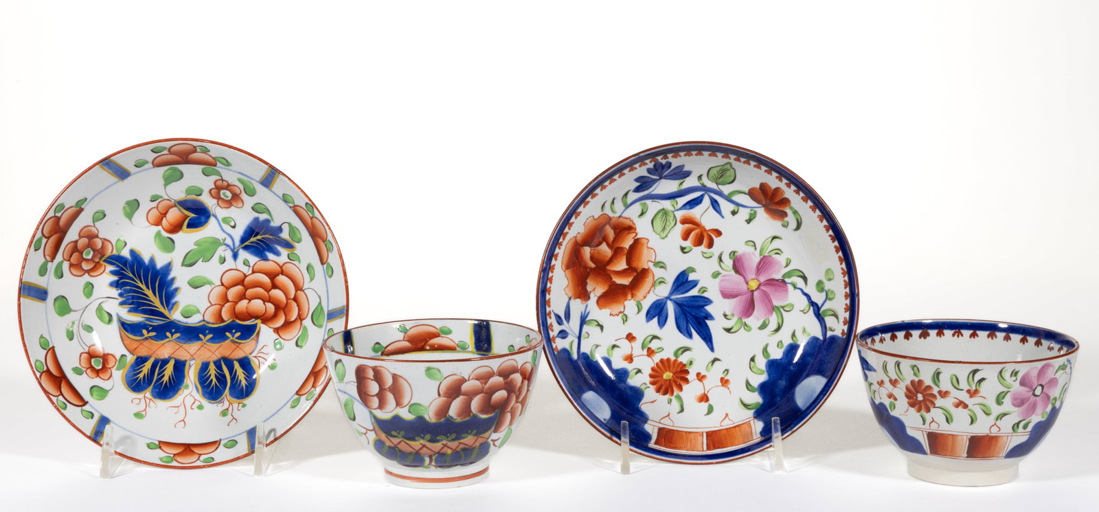 ENGLISH PEARLWARE HAND-PAINTED GAUDY DUTCH CERAMIC CUP AND SAUCER SETS, LOT OF TWO (1 of 2)