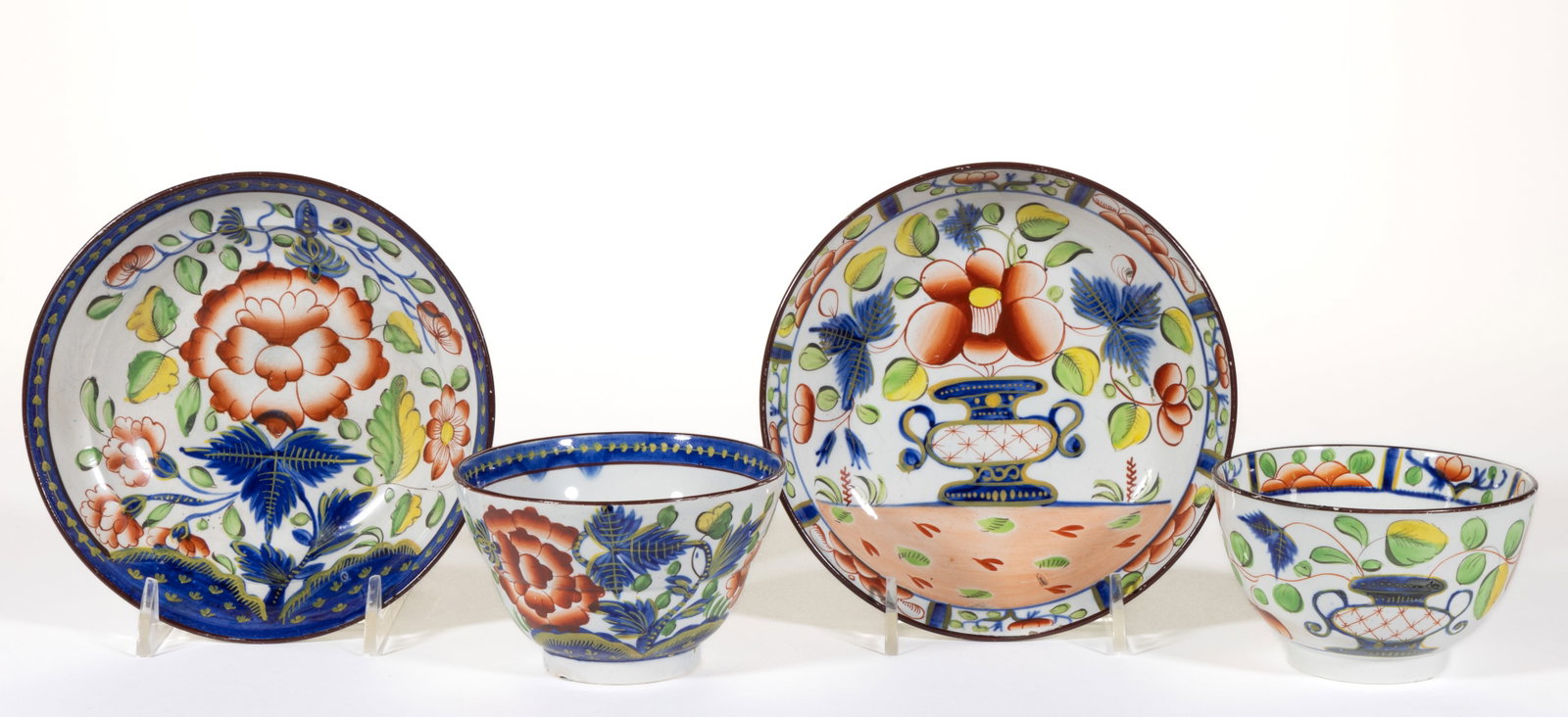 ENGLISH PEARLWARE HAND-PAINTED GAUDY DUTCH CERAMIC CUP AND SAUCER SETS, LOT OF TWO (1 of 2)