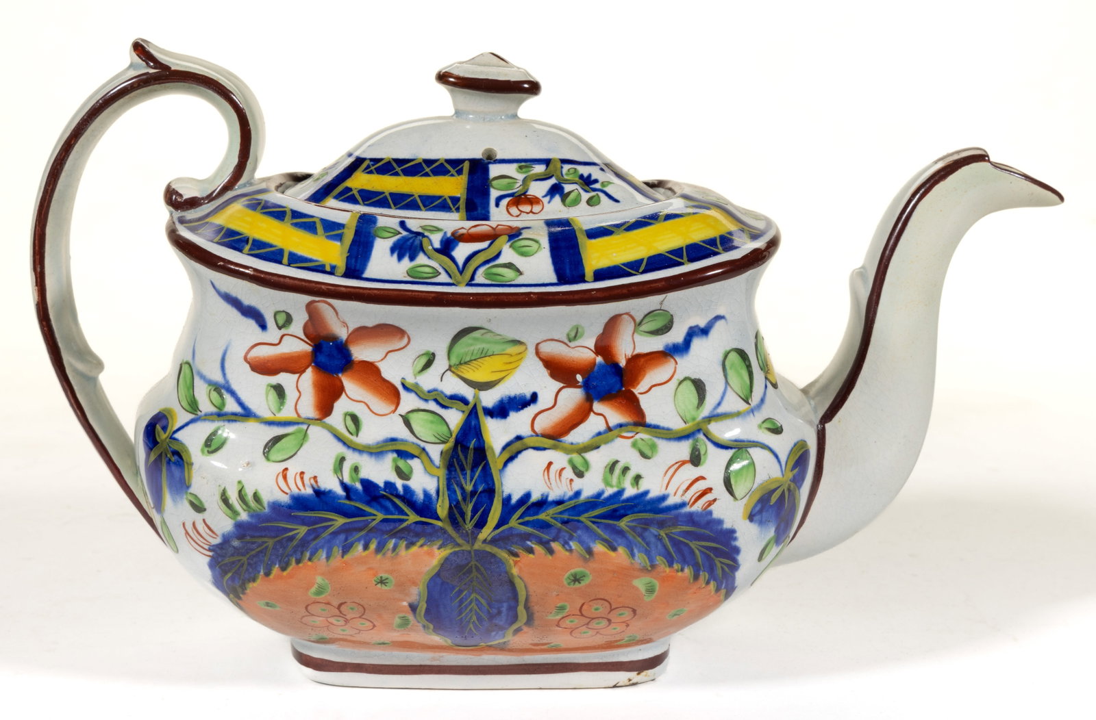 ENGLISH PEARLWARE HAND-PAINTED GAUDY DUTCH CERAMIC TEAPOT: ENGLISH PEARLWARE HAND-PAINTED GAUDY DUTCH CERAMIC TEAPOT, having bold polychrome Dove pattern. Impressed "O" to underside. First quarter 19th century. 5 5/8" HOA. Literature: 