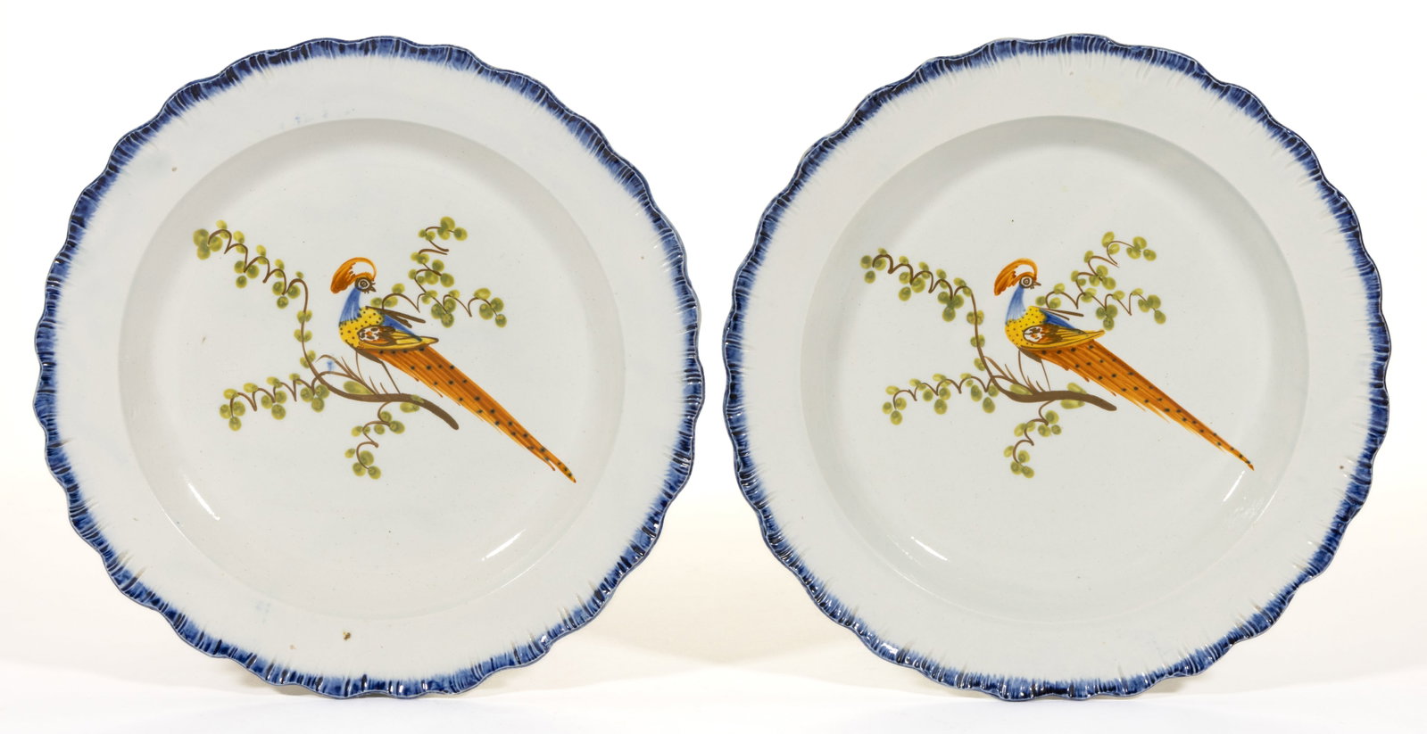 BRITISH PEARLWARE SHELL EDGE PEAFOWL CERAMIC PLATES, LOT OF TWO: BRITISH PEARLWARE SHELL EDGE PEAFOWL CERAMIC PLATES, LOT OF TWO, blue-scalloped edge decoration, featuring a polychrome hand-painted exotic bird with spotted tail perched on a branch with gr