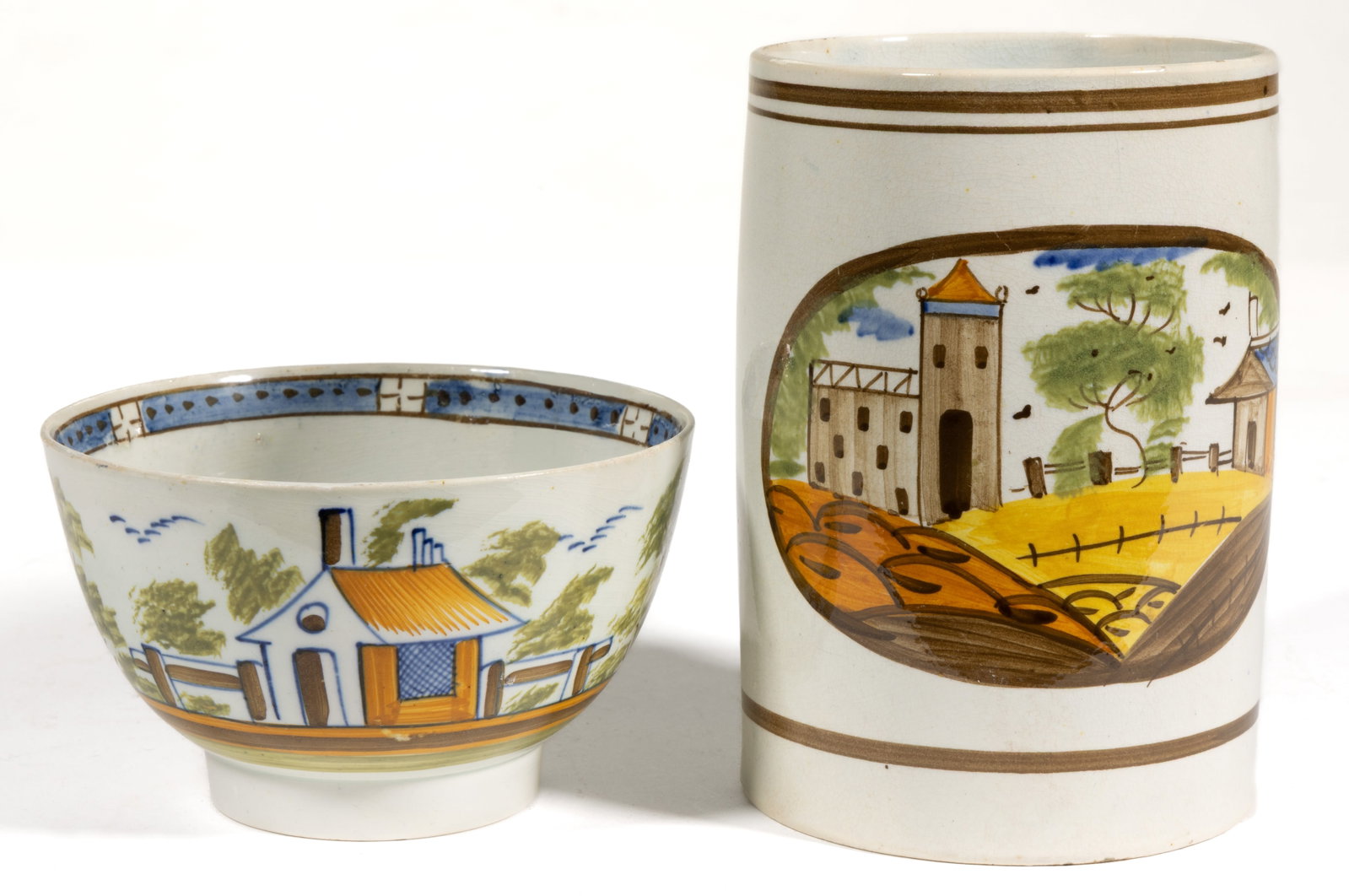 BRITISH PEARLWARE HAND-PAINTED HOUSE MOTIF CERAMIC DRINKING ARTICLES, LOT OF TWO: BRITISH PEARLWARE HAND-PAINTED HOUSE MOTIF CERAMIC DRINKING ARTICLES, LOT OF TWO, each having polychrome enamel scenes, comprising a cylindrical-form tankard having a medallion to front depicting