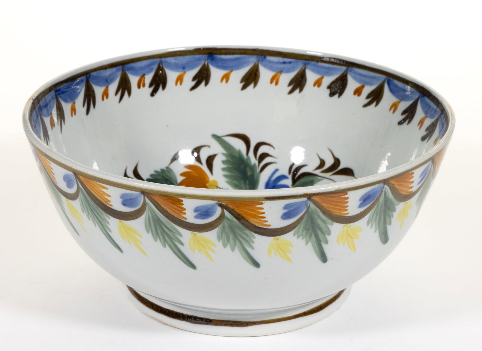 BRITISH PEARLWARE HAND-PAINTED FLORAL MOTIF CERAMIC PUNCH BOWL: BRITISH PEARLWARE HAND-PAINTED FLORAL MOTIF CERAMIC PUNCH BOWL, featuring bold polychrome designs including a large flower to interior surrounded by a floral vine and swag foliate decoration below rim