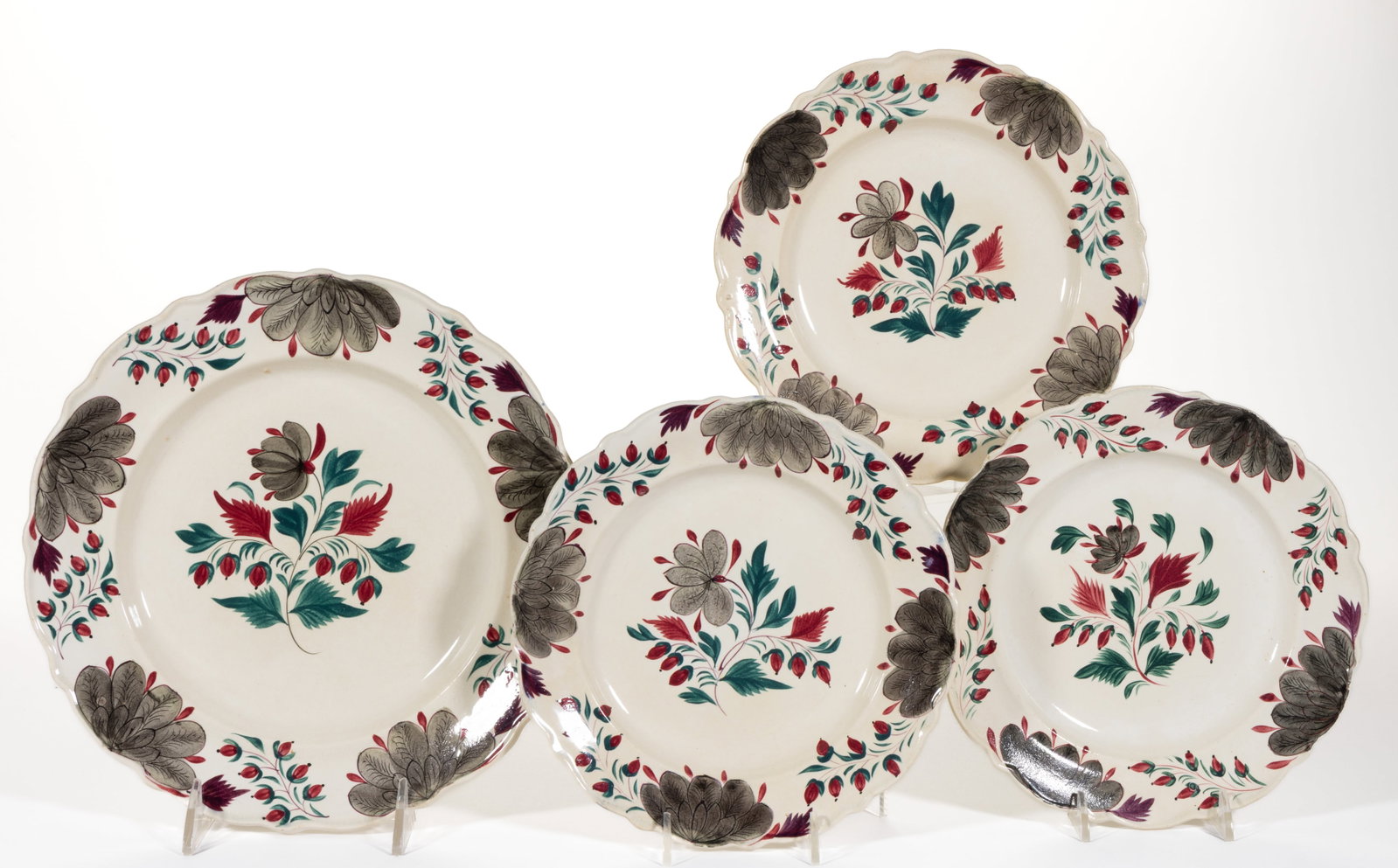 ENGLISH STAFFORDSHIRE HAND-PAINTED CERAMIC PLATES, LOT OF FOUR: ENGLISH STAFFORDSHIRE HAND-PAINTED CERAMIC PLATES, LOT OF FOUR, each having matching polychrome floral designs. Impressed marks include each smaller example having an ovoid mark with "STEVENSON&q