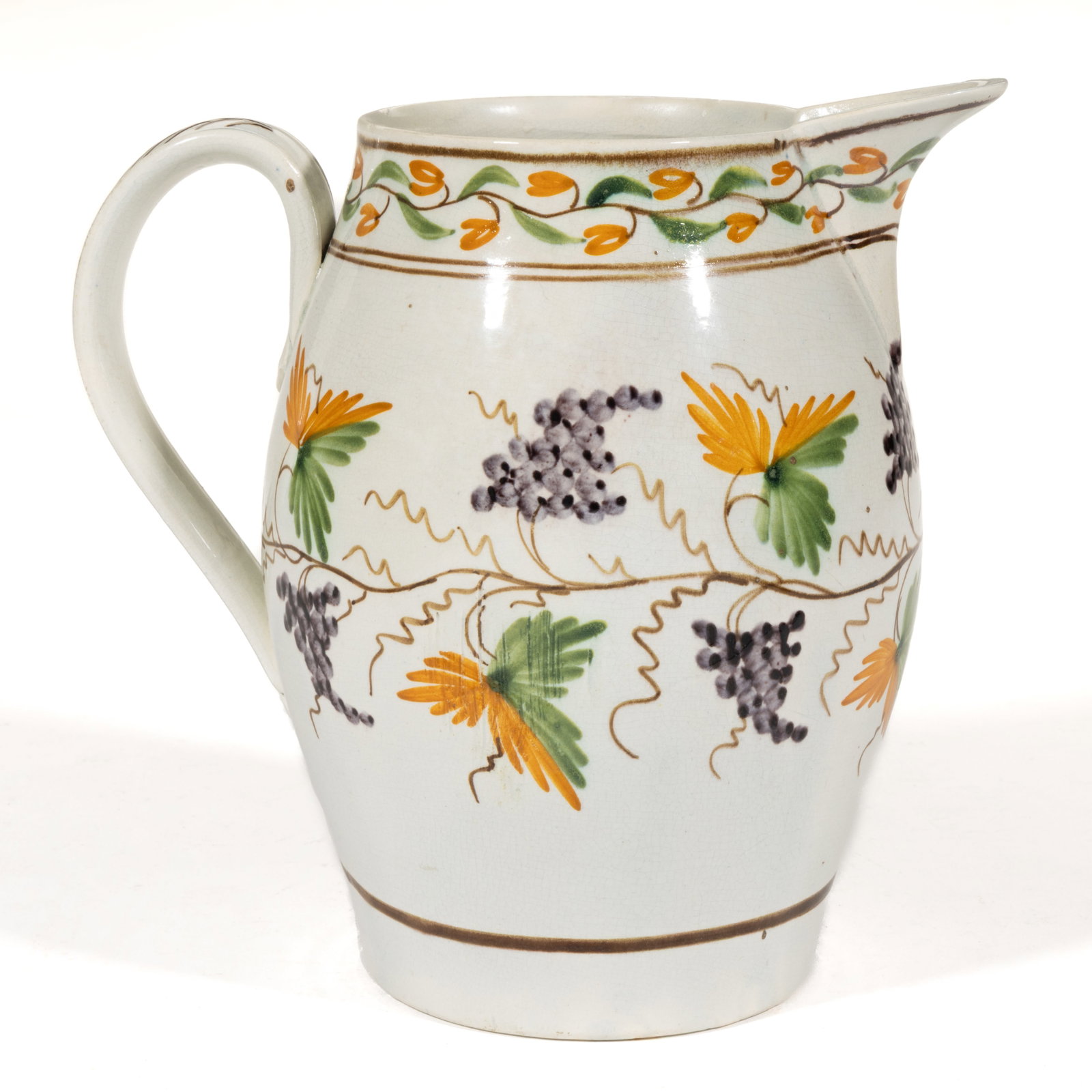 BRITISH PEARLWARE HAND-PAINTED CERAMIC JUG: BRITISH PEARLWARE HAND-PAINTED CERAMIC JUG, ovoid form, having bold polychrome design featuring a grapevine to medial body and simple floral vine below rim. Unmarked. Late 18th/early 19th century. 6 3