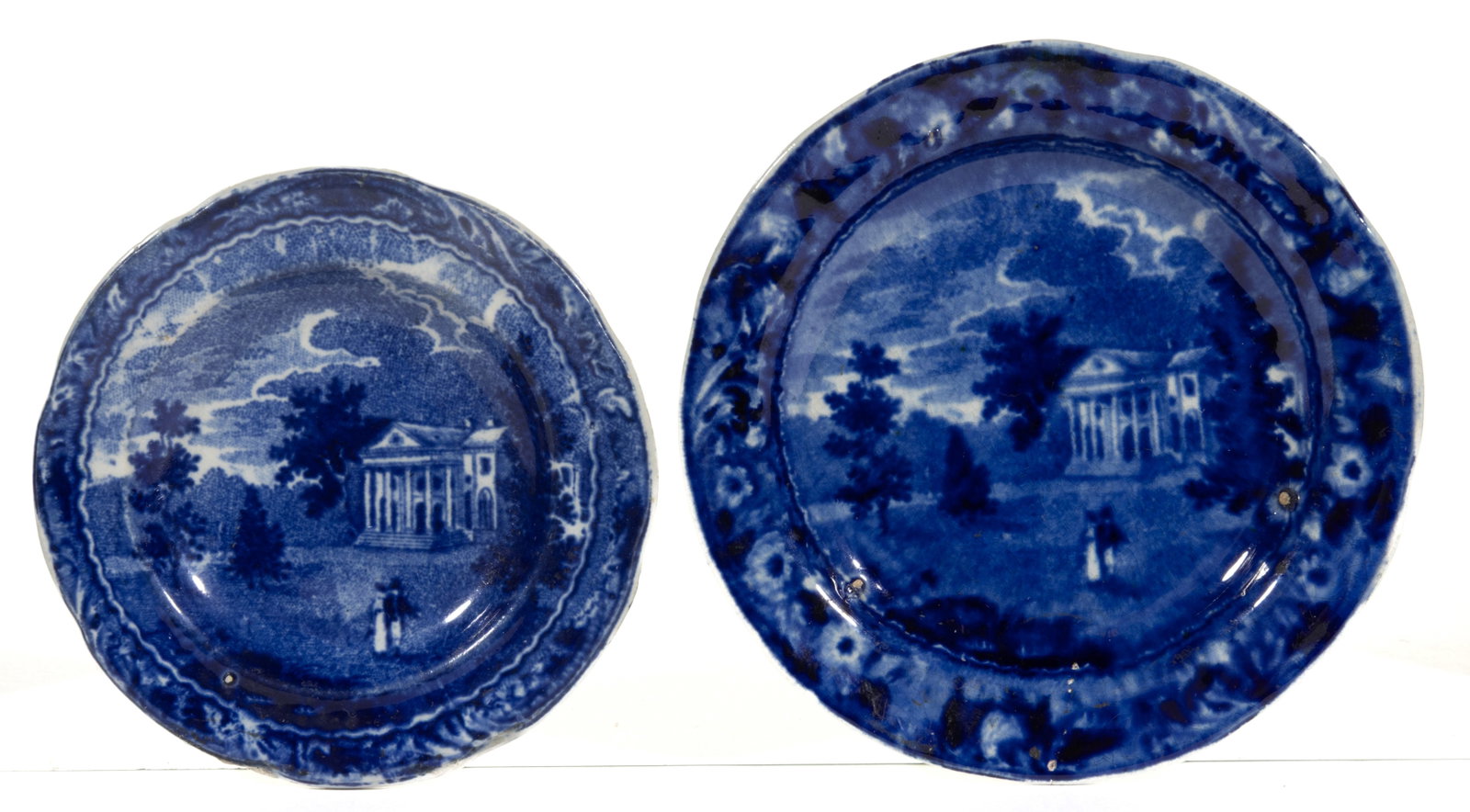 ENGLISH STAFFORDSHIRE AMERICAN VIEW PHILADELPHIA, PENNSYLVANIA TRANSFER-PRINTED CERAMIC DIMINUTIVE: ENGLISH STAFFORDSHIRE AMERICAN VIEW PHILADELPHIA, PENNSYLVANIA TRANSFER-PRINTED CERAMIC DIMINUTIVE PLATES, LOT OF TWO, each having dark blue transfer scene featuring the Woodlands near Philadelphia de