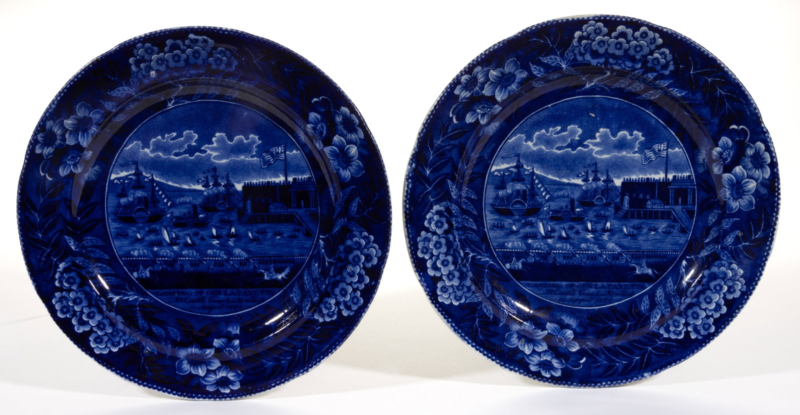 ENGLISH STAFFORDSHIRE AMERICAN HISTORICAL TRANSFER-PRINTED PLATES, LOT OF TWO: ENGLISH STAFFORDSHIRE AMERICAN HISTORICAL TRANSFER-PRINTED CERAMIC PLATES, LOT OF TWO, each featuring the "LANDING OF GEN. LA FAYETTE / At Castle Garden New York / 16th August 1824.", a