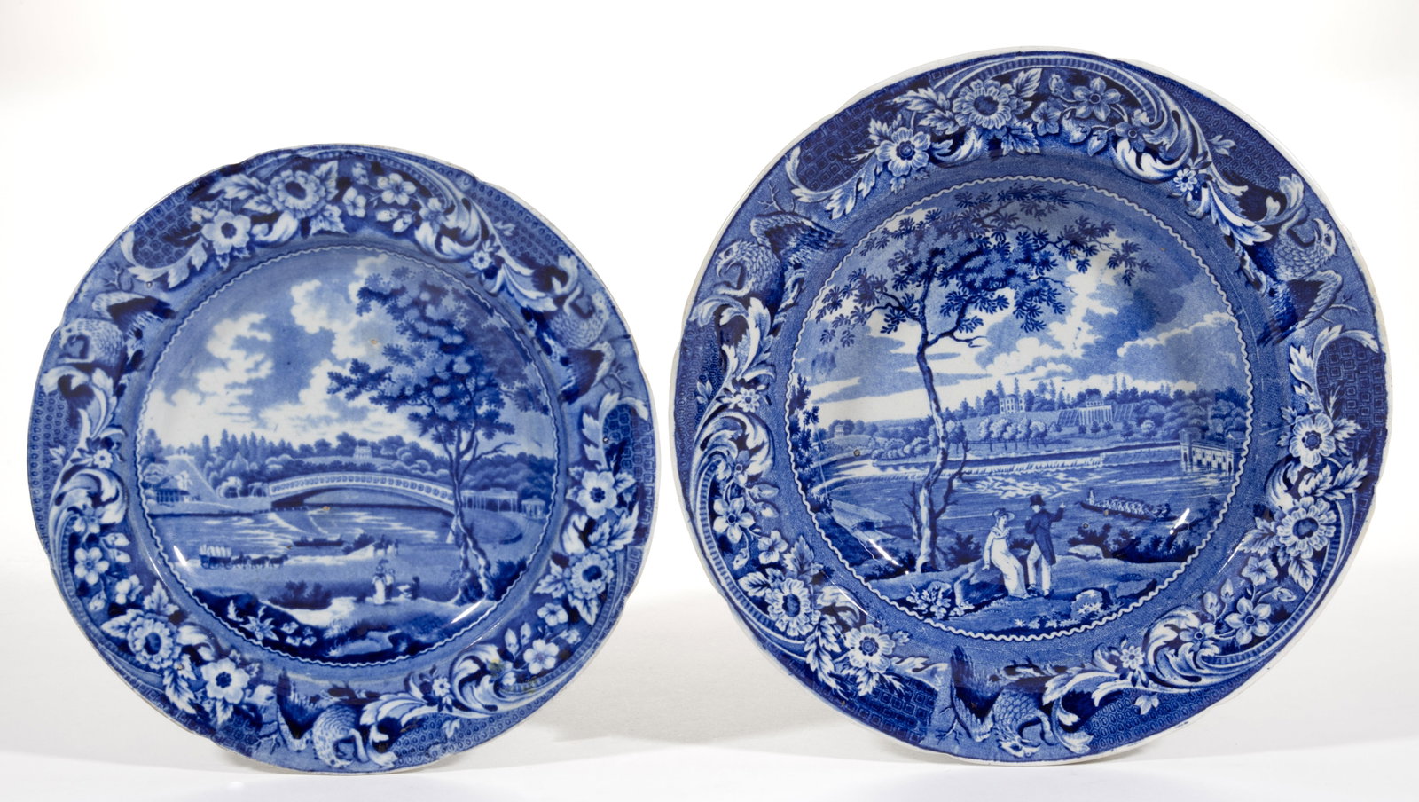 ENGLISH STAFFORDSHIRE AMERICAN VIEWS PHILADELPHIA, PENNSYLVANIA TRANSFER-PRINTED CERAMIC PLATES, LOT: ENGLISH STAFFORDSHIRE AMERICAN VIEWS PHILADELPHIA, PENNSYLVANIA TRANSFER-PRINTED CERAMIC PLATES, LOT OF TWO, each having dark blue transfer scenes with spread-wing eagle and scroll border decorat