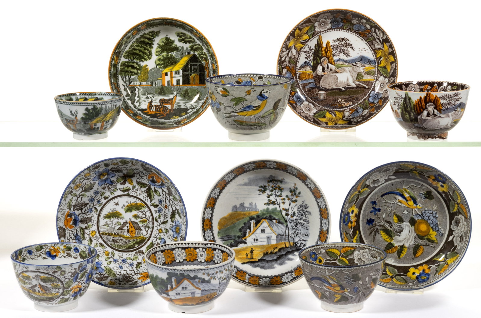 ENGLISH PEARLWARE TRANSFER-PRINTED SALOPIAN CUP AND SAUCER SETS, LOT OF FIVE: ENGLISH PEARLWARE TRANSFER-PRINTED SALOPIAN CUP AND SAUCER SETS, LOT OF FIVE, each having additional polychrome enamel decorations, comprising two sets with brown transfer scenes including o