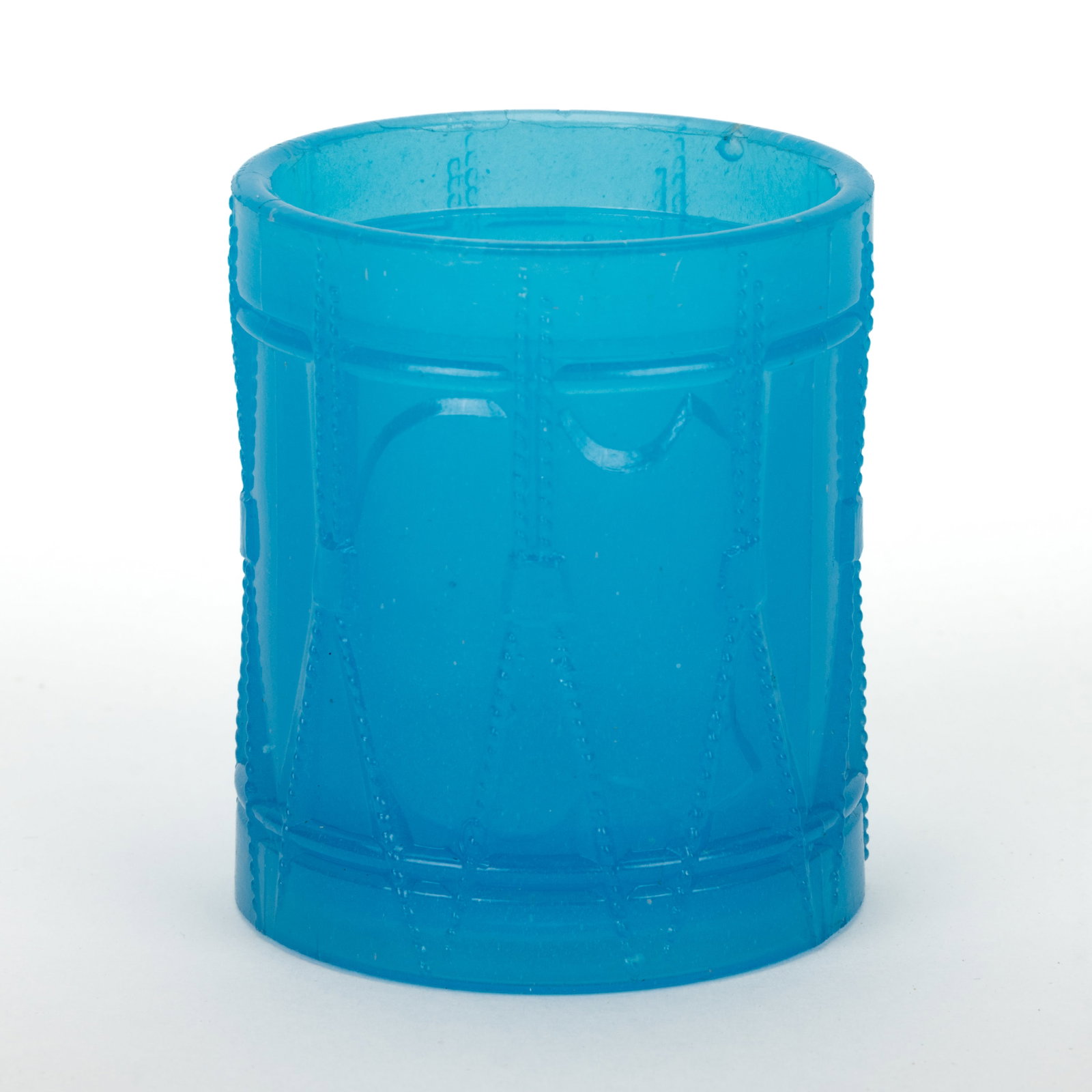 PRESSED DRUM SMALL-SIZE POMADE JAR: PRESSED DRUM SMALL-SIZE POMADE JAR, translucent starch blue, shield on side without lettering, lacking cover. Boston & Sandwich Glass Co. 1850-1870. 2 1/2" HOA, 2" D. Literature: