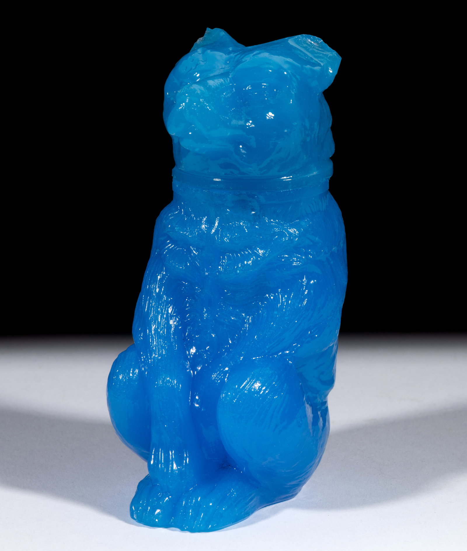 PRESSED CHAINED BEAR MEDIUM-SIZE JAR: PRESSED CHAINED BEAR MEDIUM-SIZE JAR, slightly translucent blue, embossed "X. BAZIN / PHILA" under base. Boston & Sandwich Glass Co. 1850-1870. 4 5/8" HOA, 1 5/8" D rim. Litera