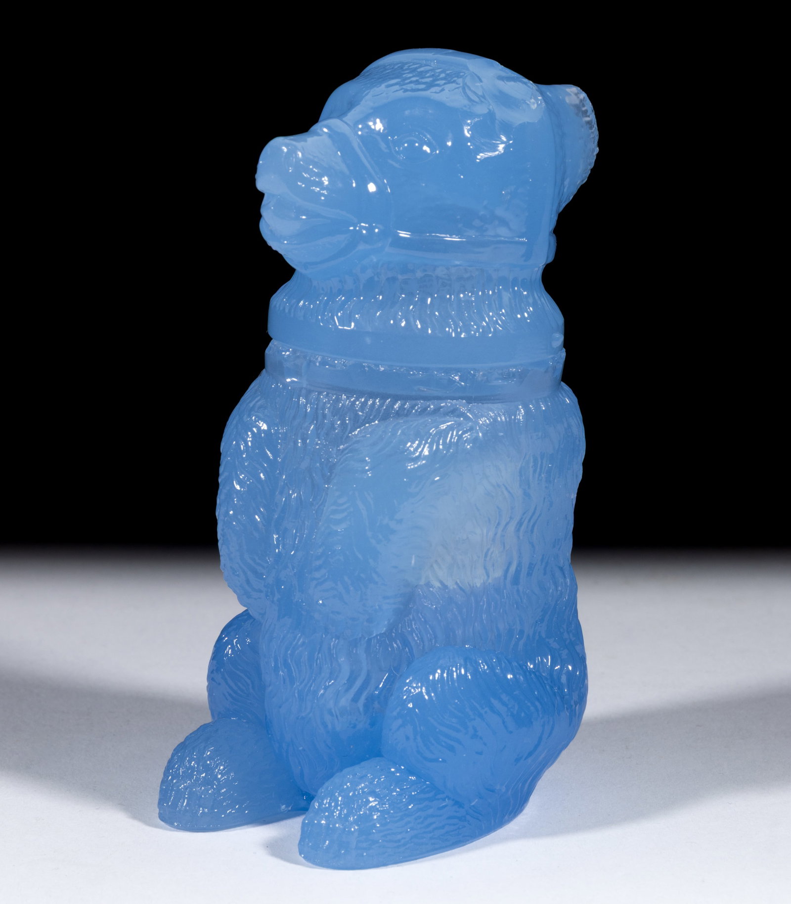 PRESSED MUZZLED BEAR MEDIUM-SIZE JAR: PRESSED MUZZLED BEAR MEDIUM-SIZE JAR, translucent soft blue, plain base. Boston & Sandwich Glass Co. 1850-1887. 4 1/2" HOA, 1 5/8" D rim. Literature: Parallels Barlow/Kaiser - The Glass