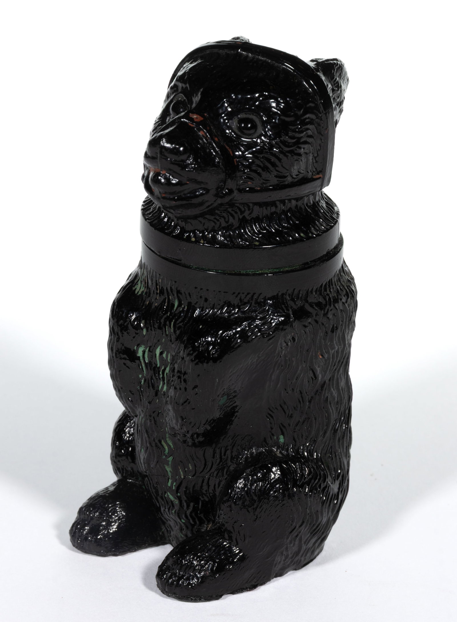 PRESSED MUZZLED BEAR MEDIUM-SIZE JAR: PRESSED MUZZLED BEAR MEDIUM-SIZE JAR, opaque black, embossed "EUGENE BIZE & FRICKE / SUCCESSORS / TO / J. HAUEL & C" under base. Boston & Sandwich Glass Co. 1850-1887. 4