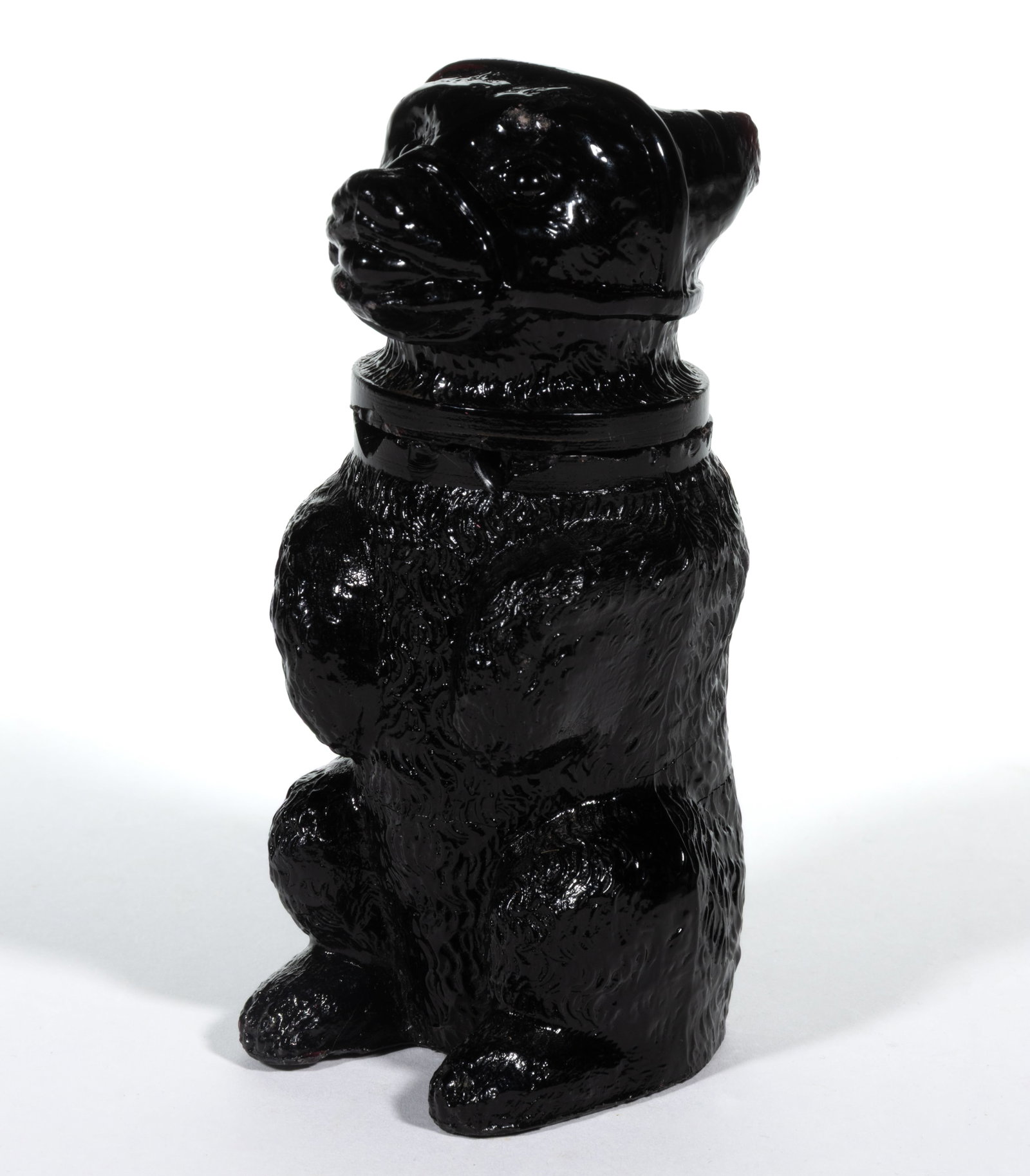 PRESSED MUZZLED BEAR LARGE-SIZE JAR: PRESSED MUZZLED BEAR LARGE-SIZE JAR, opaque black deep amethyst, embossed "R & G . A . WRIGHT / PHILADA." to the underside of the base. Boston & Sandwich Glass Co. 1850-1887.