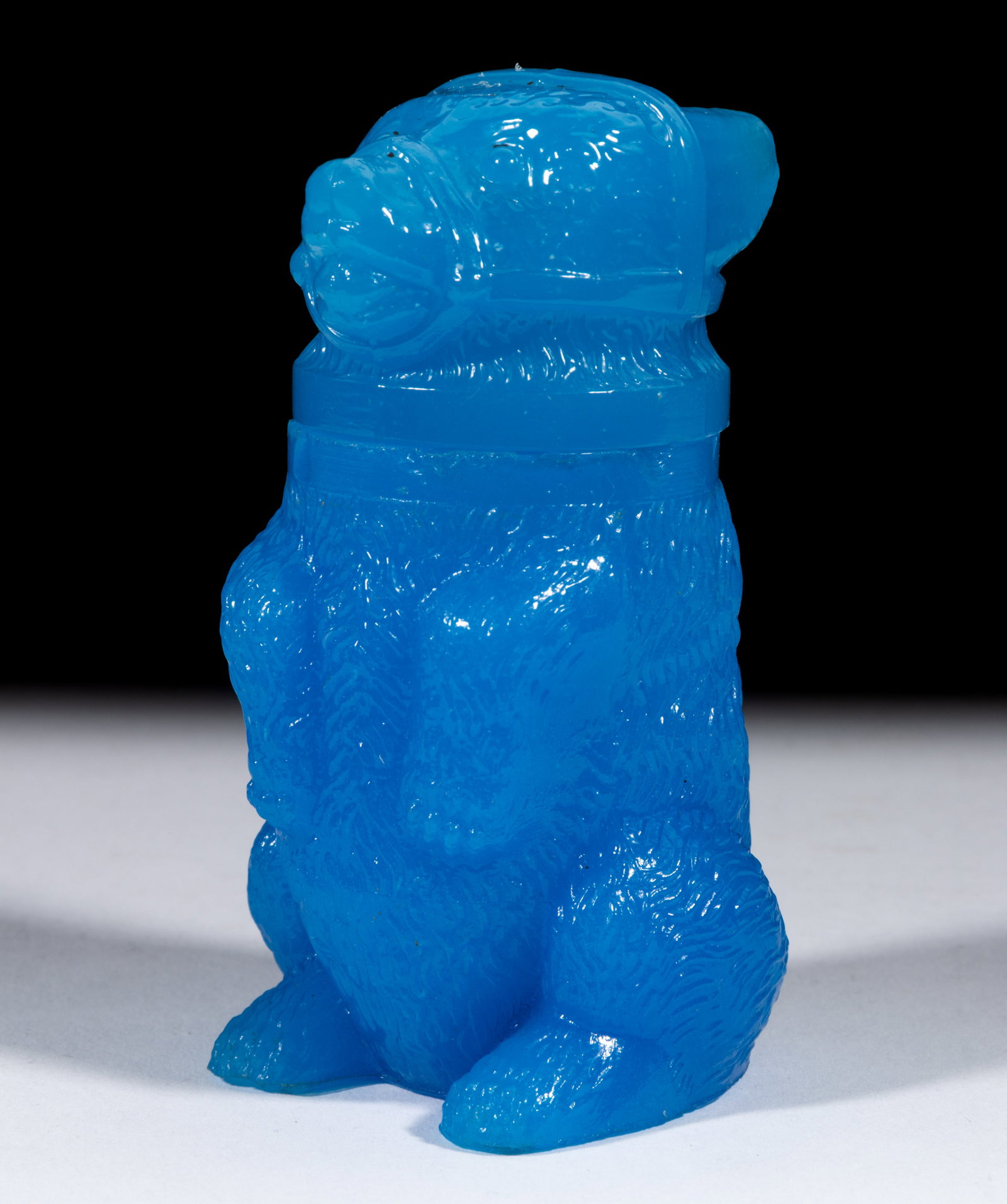 PRESSED MUZZLED BEAR SMALL-SIZE JAR: PRESSED MUZZLED BEAR SMALL-SIZE JAR, translucent starch blue, embossed "X. BAZIN / PHILADA" under base, matching cover. Boston & Sandwich Glass Co. 1850-1887. 3 3/4" HOA, 1