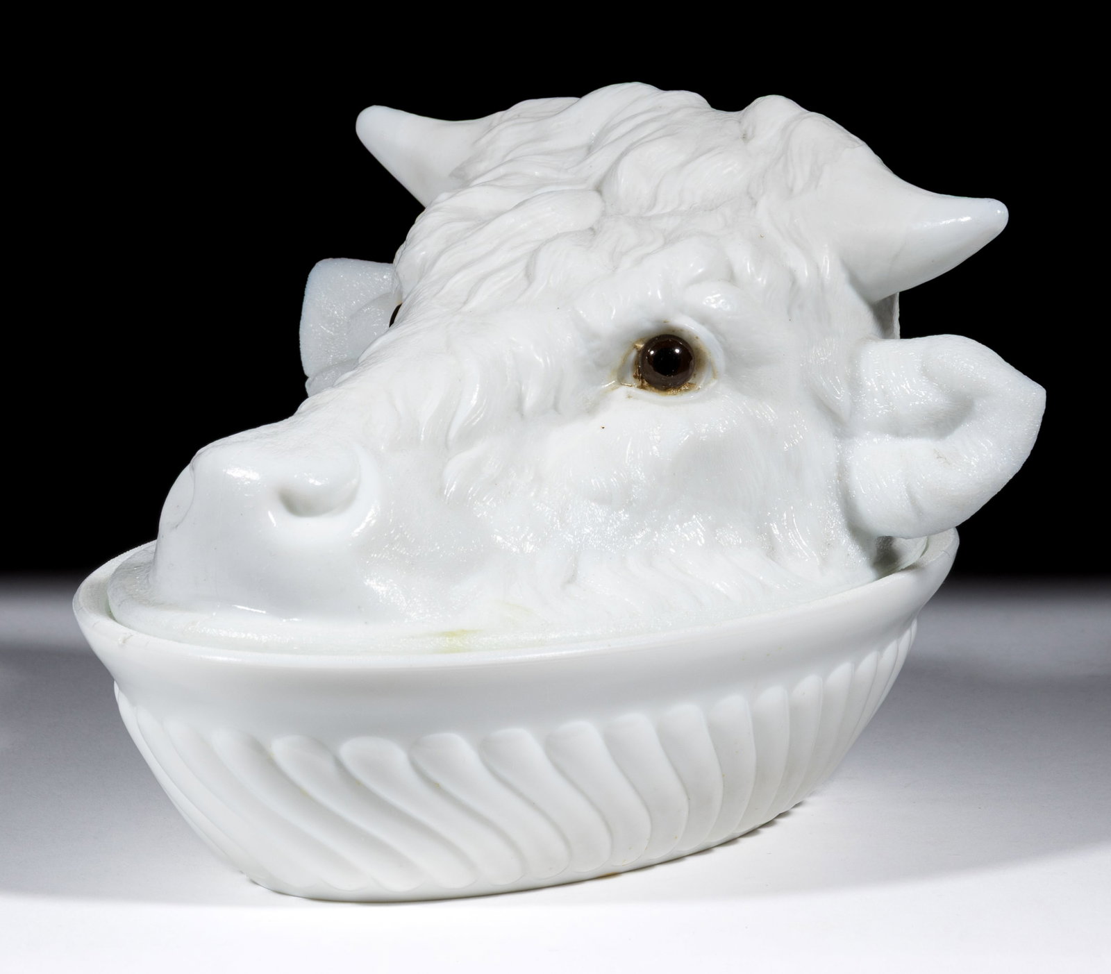 STEER'S HEAD COVERED DISH: STEER'S HEAD COVERED DISH, opaque white/milk glass, with applied deep brown/black eyes. Challinor, Taylor & Co. 1885-1893. 5 HOA, 5 1/4" x 7 7/8" base rim. Literature: