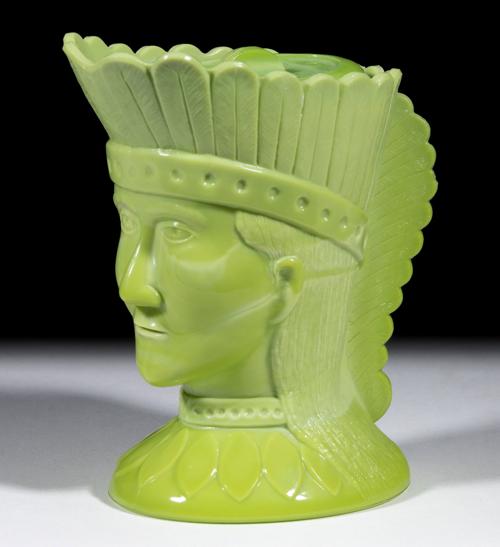 GREENTOWN INDIAN HEAD CREAMER: GREENTOWN INDIAN HEAD CREAMER, Nile Green, with extremely rare cover. Indiana Tumbler and Goblet Co. Early 20th century. 5 3/4" HOA. Literature: Parallels NGGA/Measell (ed.) - Greentown Glas