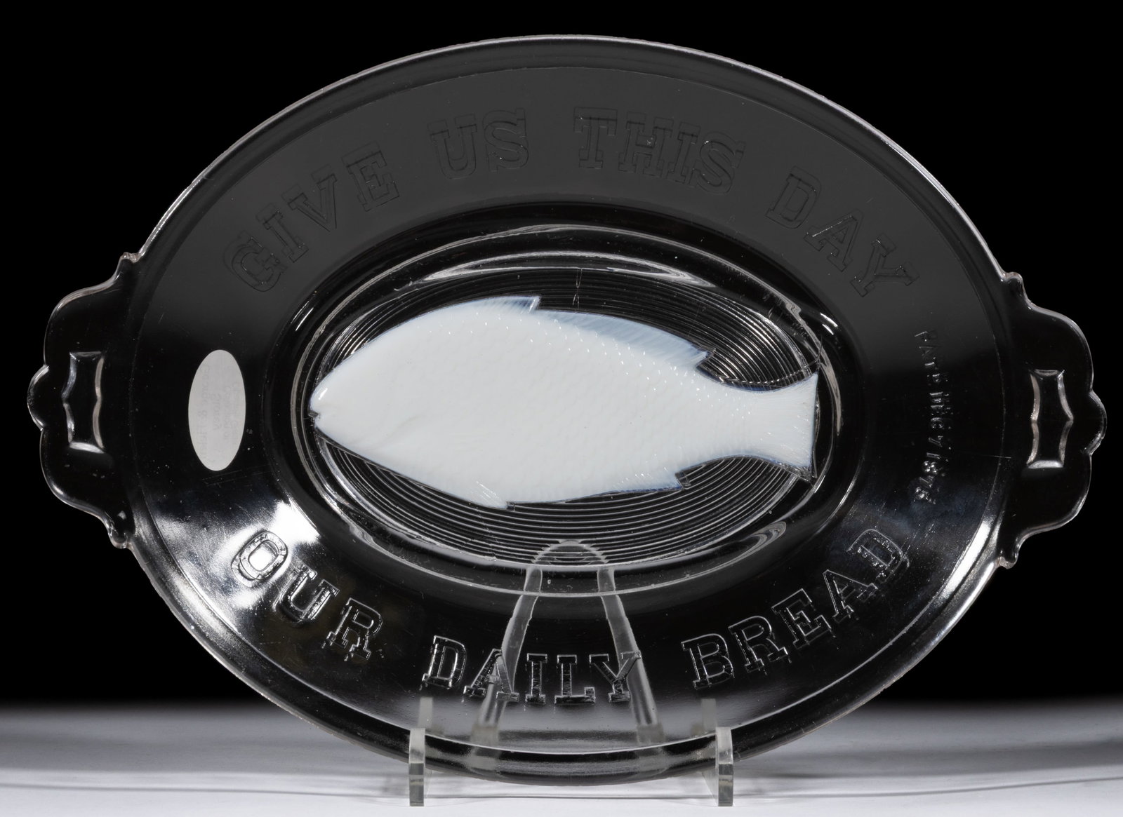 ATTERBURY FISH FUSED GLASS BREAD TRAY: ATTERBURY FISH FUSED GLASS BREAD TRAY, colorless and milk glass, embossed around the edge "GIVE US THIS DAY / OUR DAILY BREAD", "PATD DEC 7 1875", with a center milk glass fish.