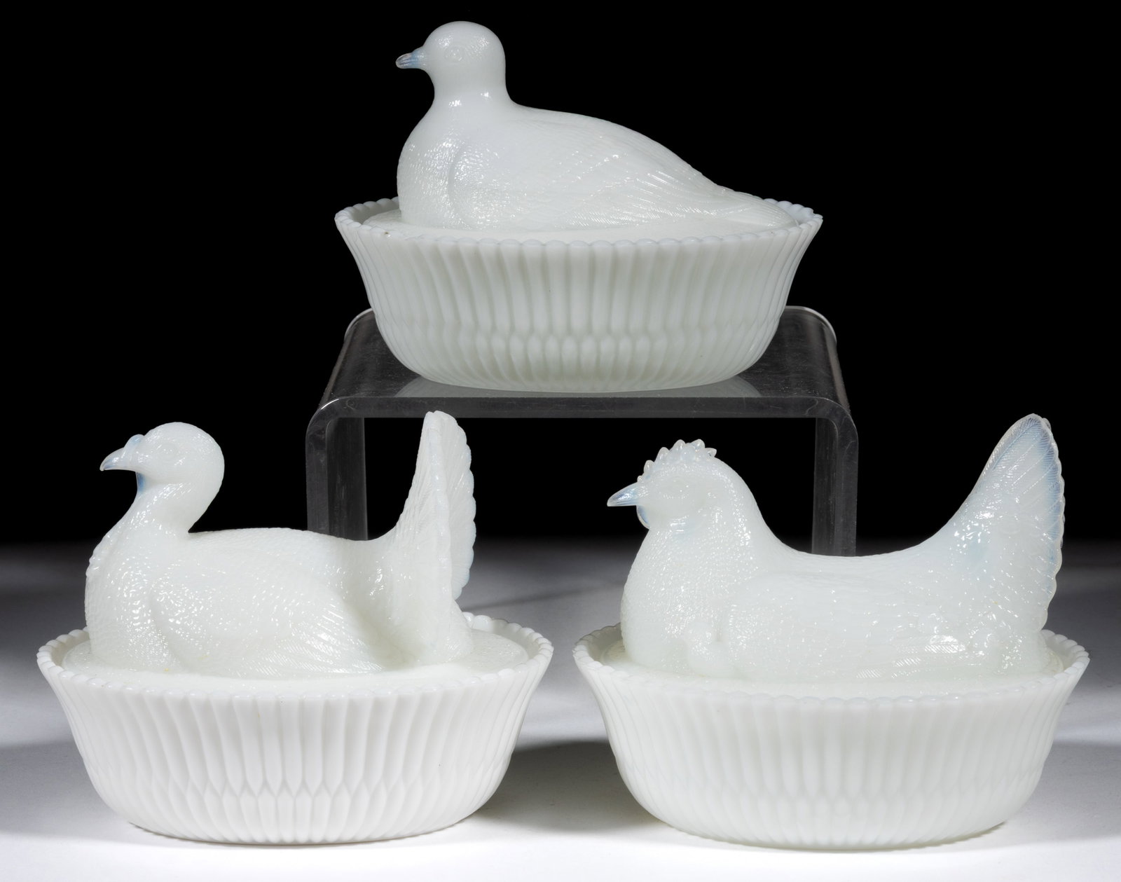 ASSORTED MCKEE NOVELTY FIGURAL ANIMAL COVERED DISHES, LOT OF THREE: ASSORTED MCKEE NOVELTY FIGURAL ANIMAL COVERED DISHES, LOT OF THREE, opaque white/milk glass, comprising a dove, hen with chicks, and turkey, each with split-rib base, each marked "McKEE
