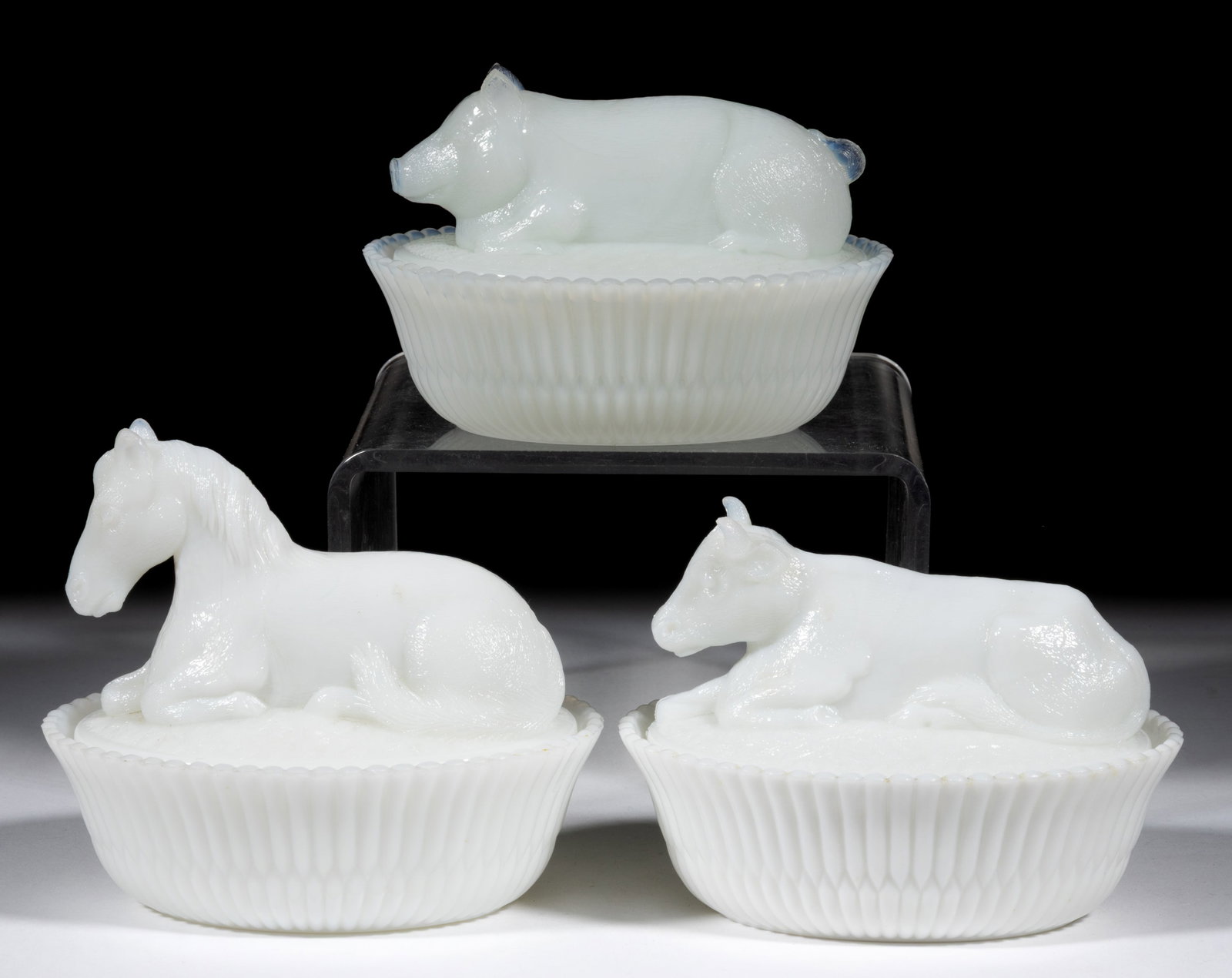 ASSORTED MCKEE NOVELTY FIGURAL ANIMAL COVERED DISHES, LOT OF THREE: ASSORTED MCKEE NOVELTY FIGURAL ANIMAL COVERED DISHES, LOT OF THREE, opaque white/milk glass, comprising a cow, horse, and pig, each with split-rib base, each marked "McKEE" to the underside