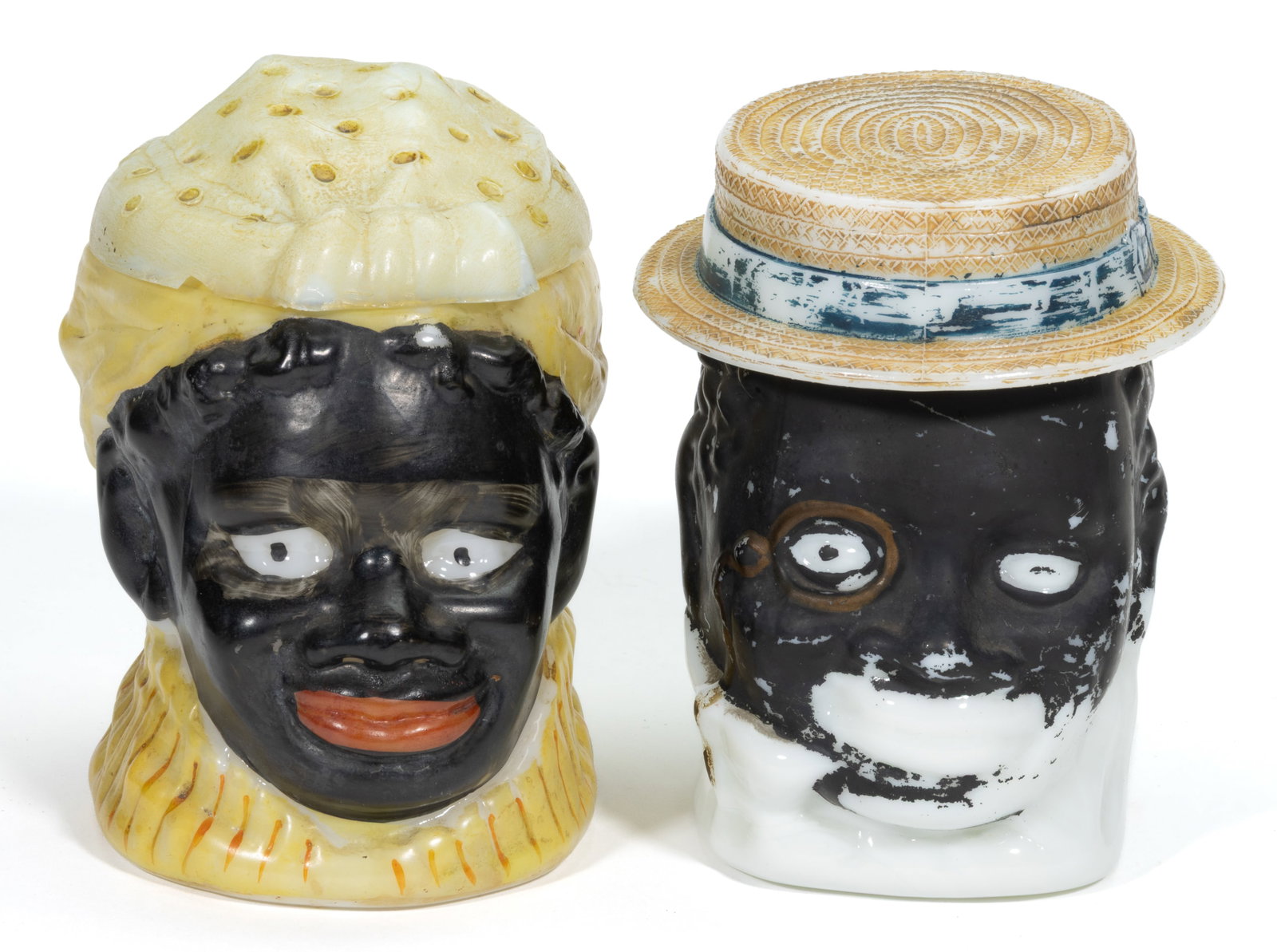 BLACK AMERICANA MAMMY AND PAPPY TOBACCO JARS, LOT OF TWO: BLACK AMERICANA MAMMY AND PAPPY TOBACCO JARS, LOT OF TWO, opaque white/milk glass with original paint decoration. Late 19th/early 20th century. 5 1/4" and 5 1/2" HOA. Published: Ch