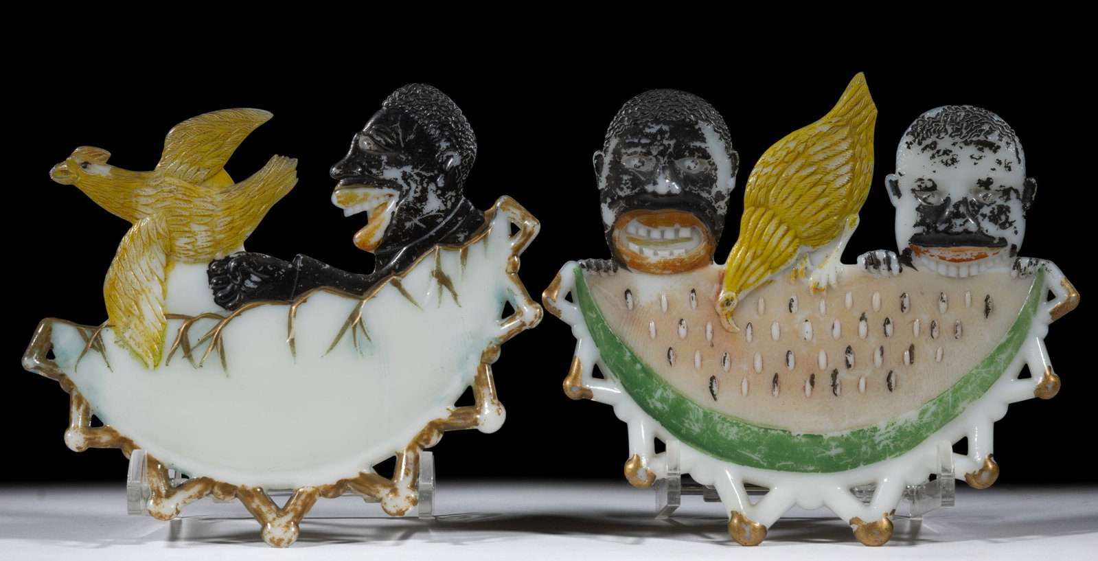 ASSORTED PRESSED BLACK AMERICANA PLATES, LOT OF TWO: ASSORTED PRESSED BLACK AMERICANA PLATES, LOT OF TWO, opaque white/milk glass with original paint decoration, comprising black boy chasing chicken plate and watermelon eater plate. Late 19th/early