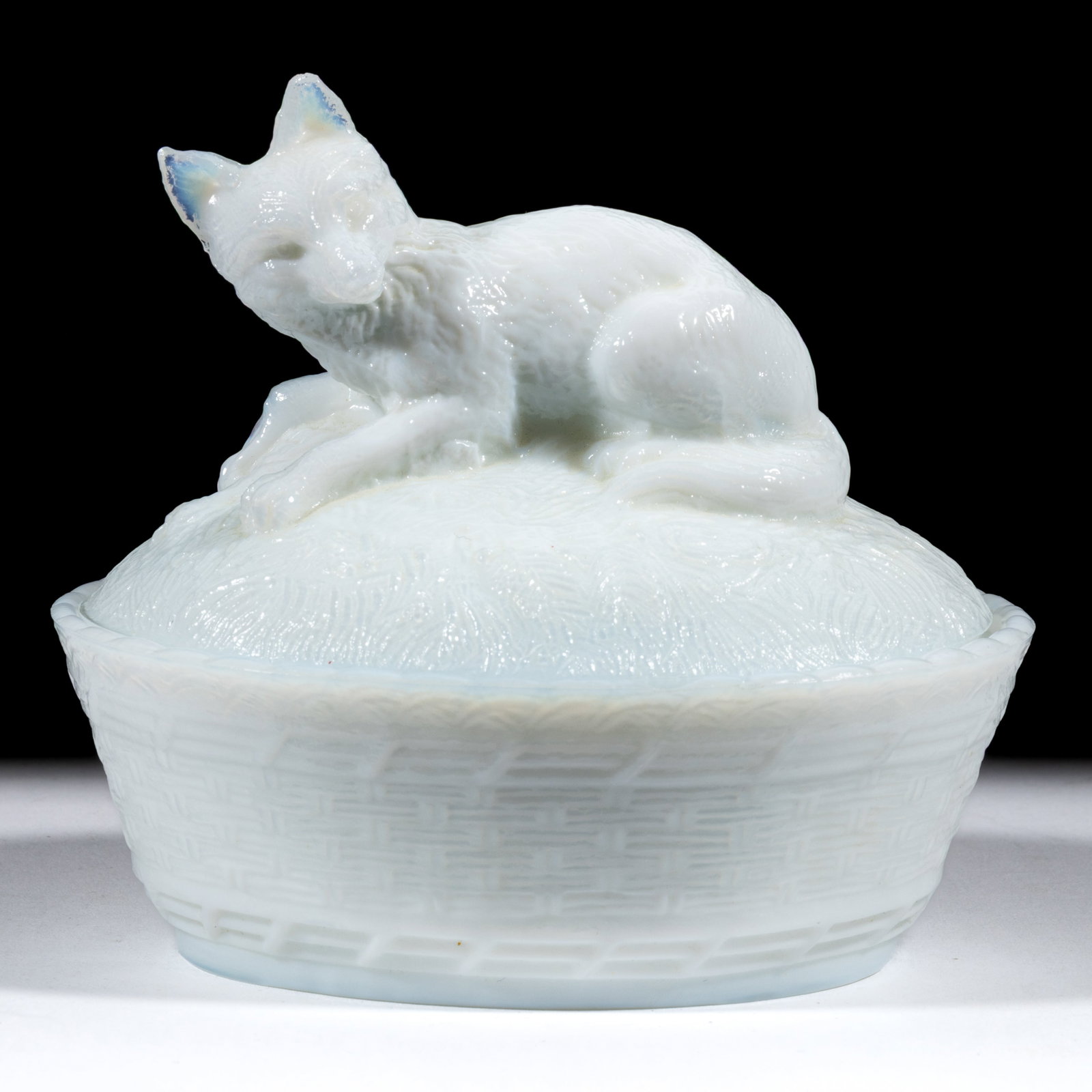FOX AND BASKETWEAVE COVERED DISH: FOX AND BASKETWEAVE COVERED DISH, opaque white/milk glass, oval dish with basketweave base. Maker unverified, possibly Continental. Late 19th/early 20th century. 4 1/4" HOA, 4 1/8" x 5