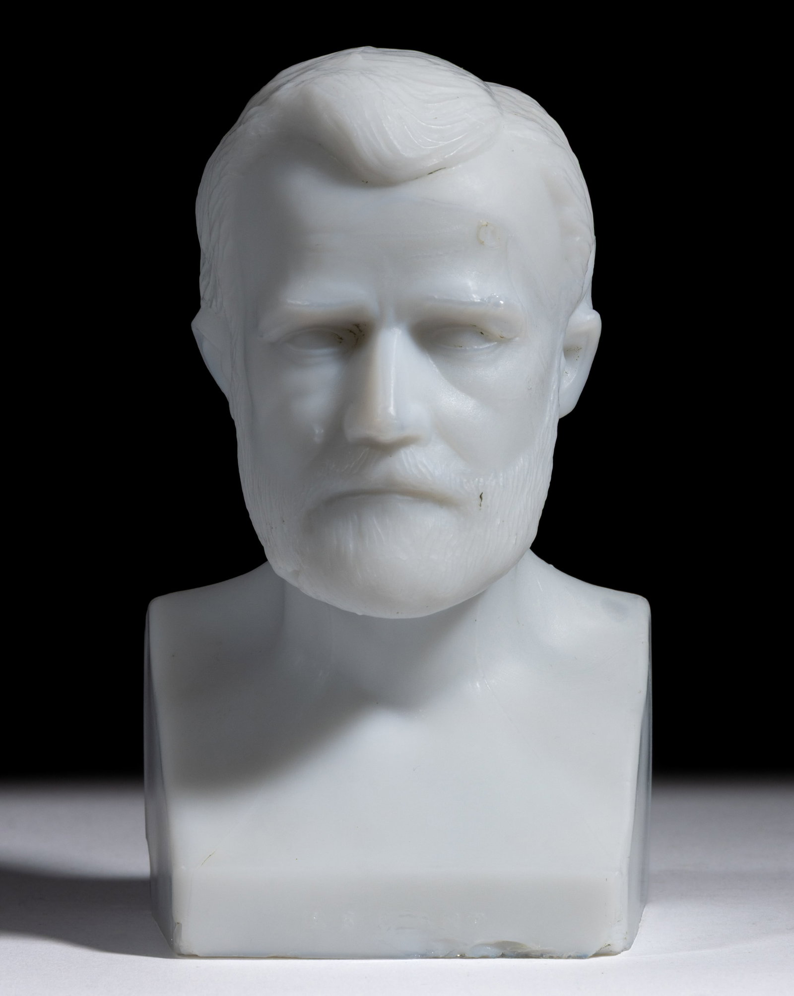 1876 PHILADELPHIA CENTENNIAL GLASS FIGURAL ULYSSES S. GRANT BUST / PAPERWEIGHT: 1876 PHILADELPHIA CENTENNIAL GLASS FIGURAL ULYSSES S. GRANT BUST / PAPERWEIGHT, opaque white/milk glass with satin surface, solid shoulder-length bust or statuette of the President with square-form ba