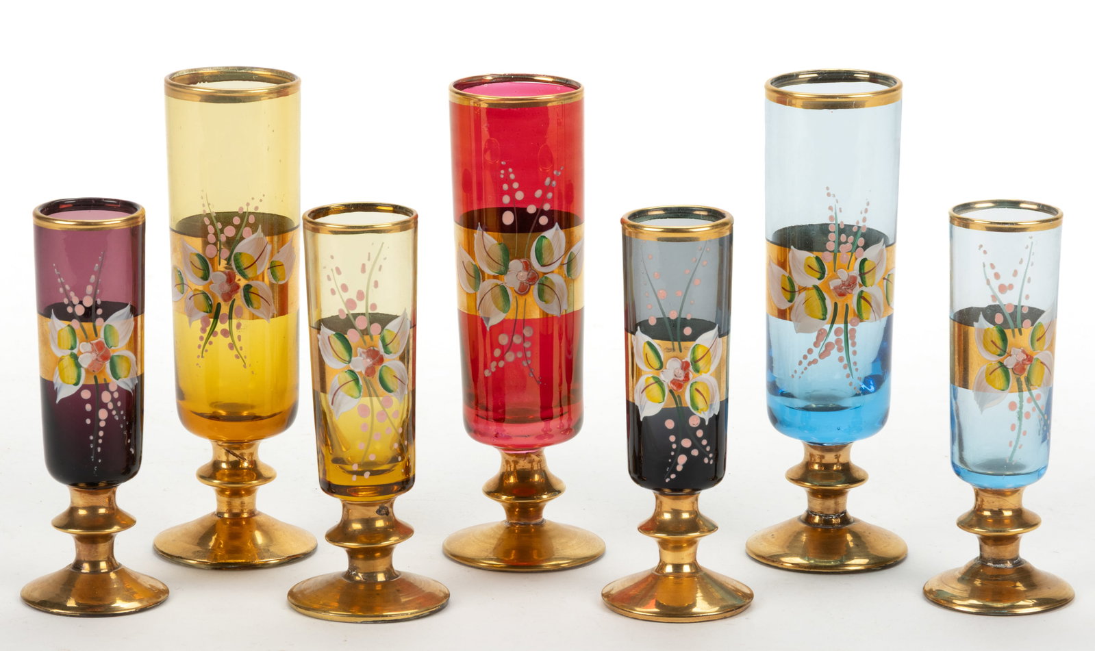 VENETIAN / MURANO GILT AND ENAMEL DECORATED SEVEN-PIECE LIQUOR SET, LOT OF SEVEN: VENETIAN / MURANO GILT AND ENAMEL DECORATED SEVEN-PIECE LIQUOR SET, LOT OF SEVEN, various colors, comprising three footed wines and four liquor glasses. Early 20th century. 4 1/2" to 5 