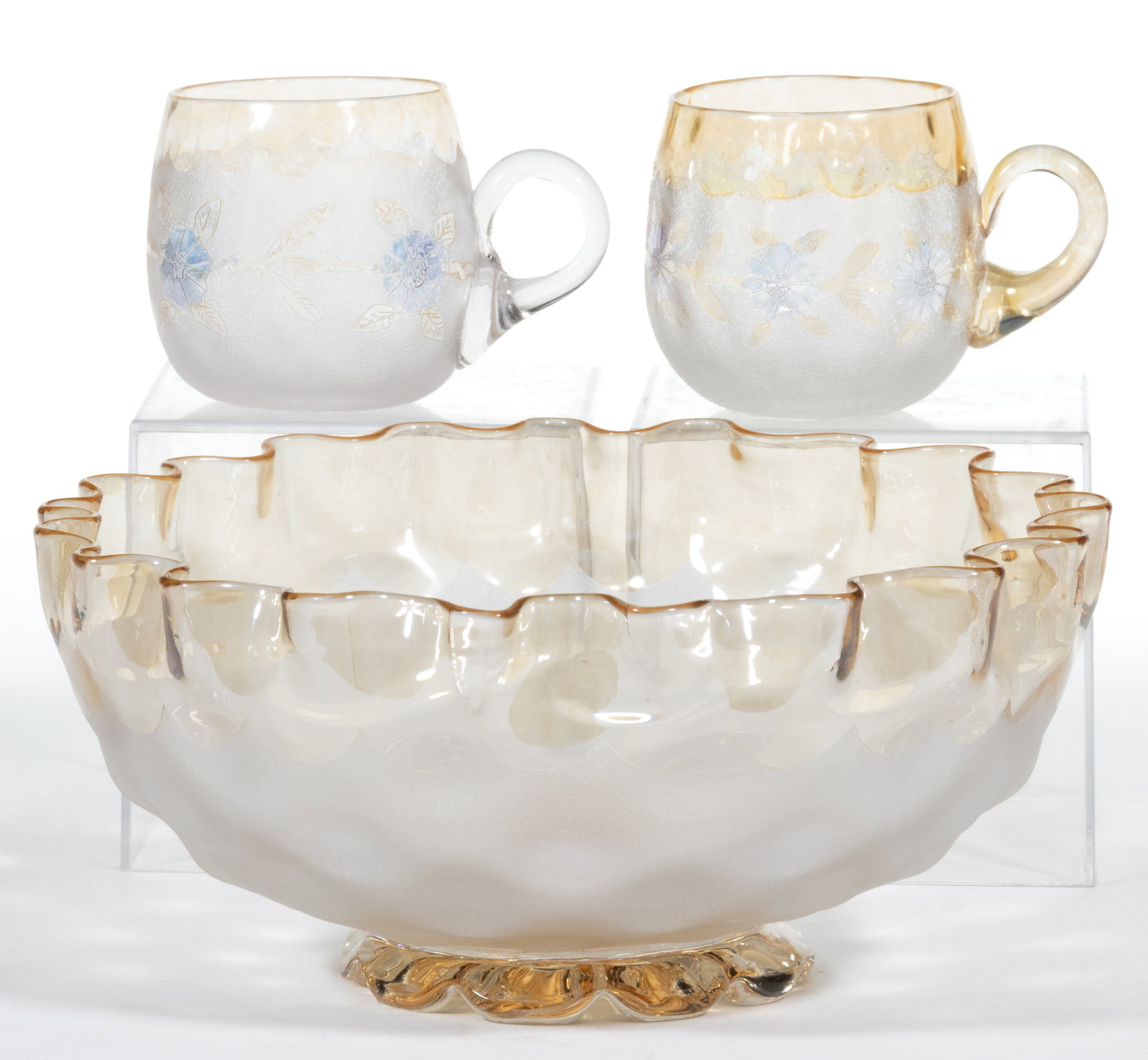 POMONA FIRST-PATENT ETCHING ART GLASS ARTICLES, LOT OF THREE: POMONA - FIRST-PATENT ETCHING ART GLASS ARTICLES, LOT OF THREE, colorless with amber and blue iridescence, comprising a first-patented and second-patented etched cornflower punch cups and a 