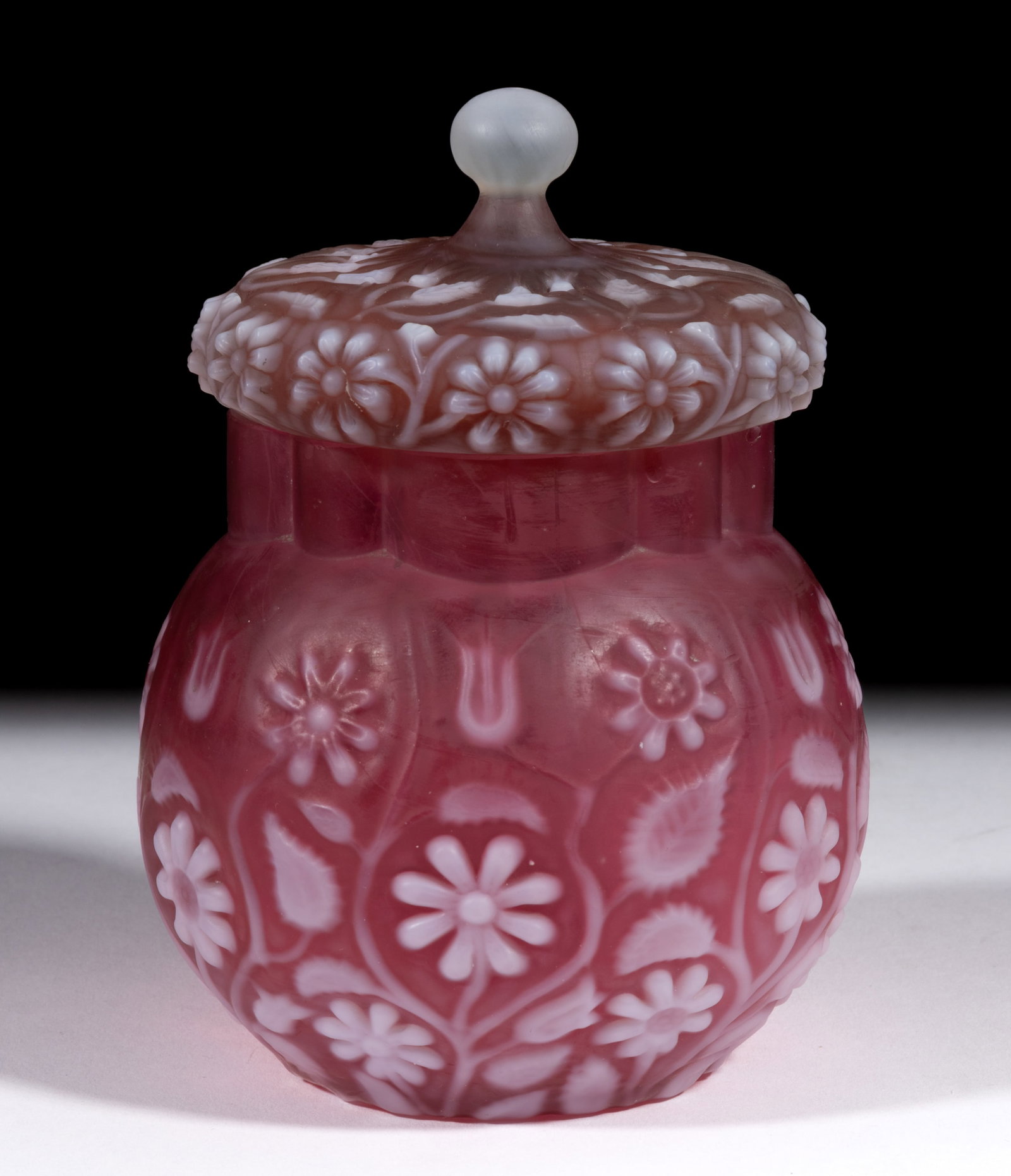 FINDLAY FLORADINE COVERED SUGAR BOWL: FINDLAY FLORADINE COVERED SUGAR BOWL, ruby with opalescent flowers and satin finish, matching cover with applied frosted colorless finial. Dalzell, Gilmore & Leighton Co. Circa 1889. 6" HOA. 