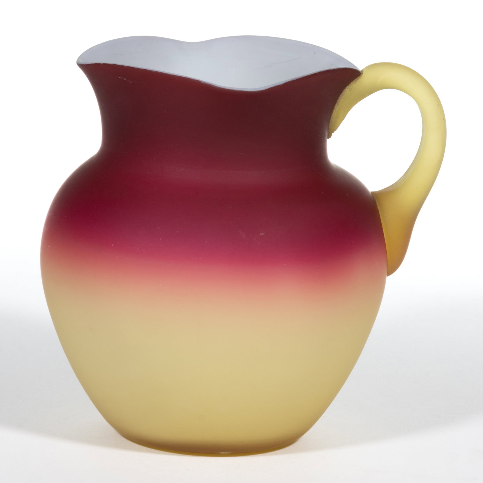HOBBS CORAL (OMN) / PEACH BLOW NO. 319 / NO. 0 JUG / PITCHER: HOBBS CORAL (OMN) / PEACH BLOW NO. 319 / NO. 0 JUG / PITCHER, satin finish, square rim, applied handle, polished pontil mark. Hobbs, Brockunier & Co. Circa 1885. 4 1/2" H. Literature: Paralle