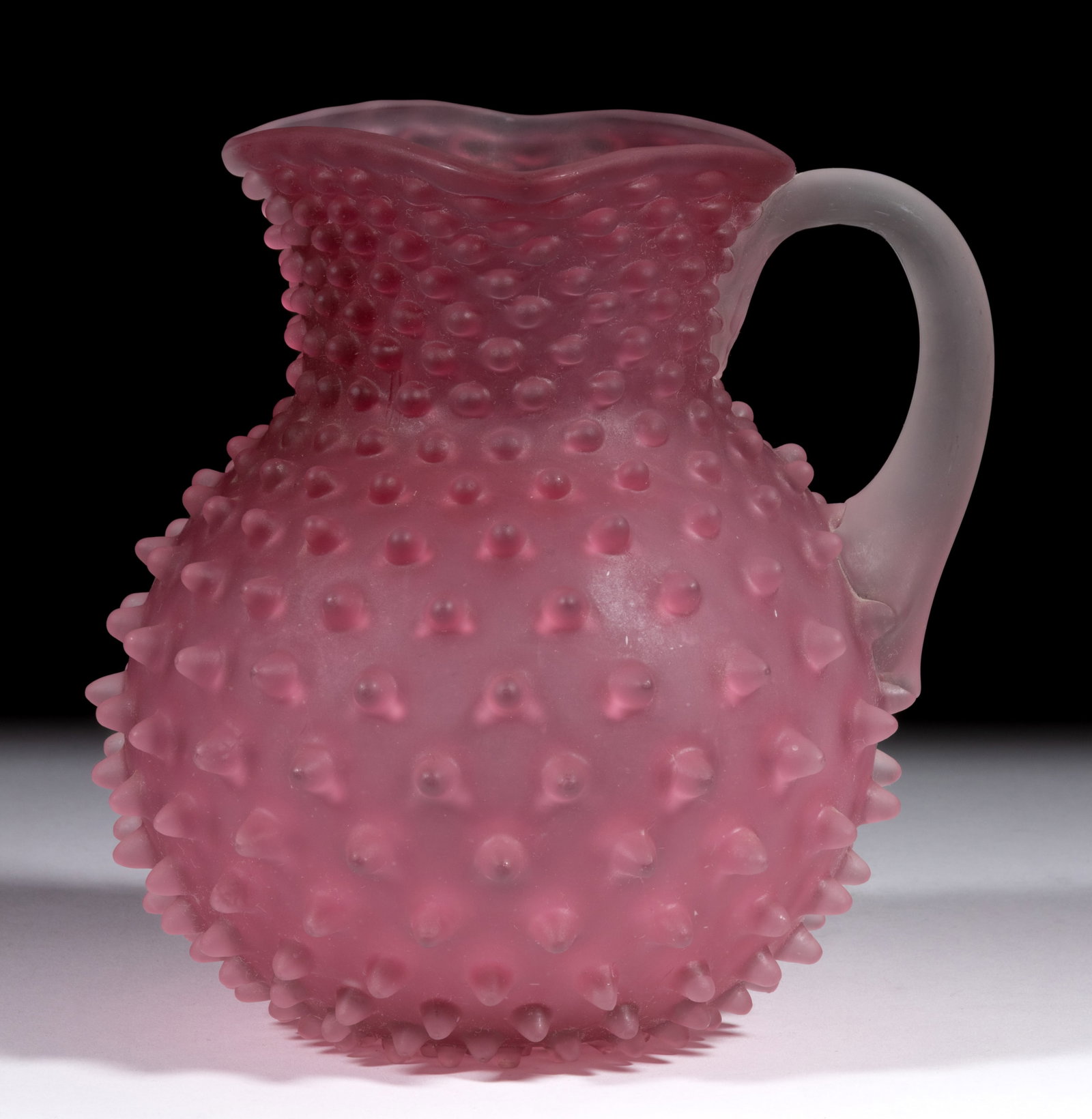 HOBBS NO. 323 DEW DROP / HOBNAIL NO. 5 JUG / PITCHER: HOBBS NO. 323 DEW DROP / HOBNAIL NO. 5 JUG / PITCHER, pink Richelieu with satin finish, square rim, colorless applied handle with polished pontil mark. Hobbs, Brockunier & Co. Pattern introduced i
