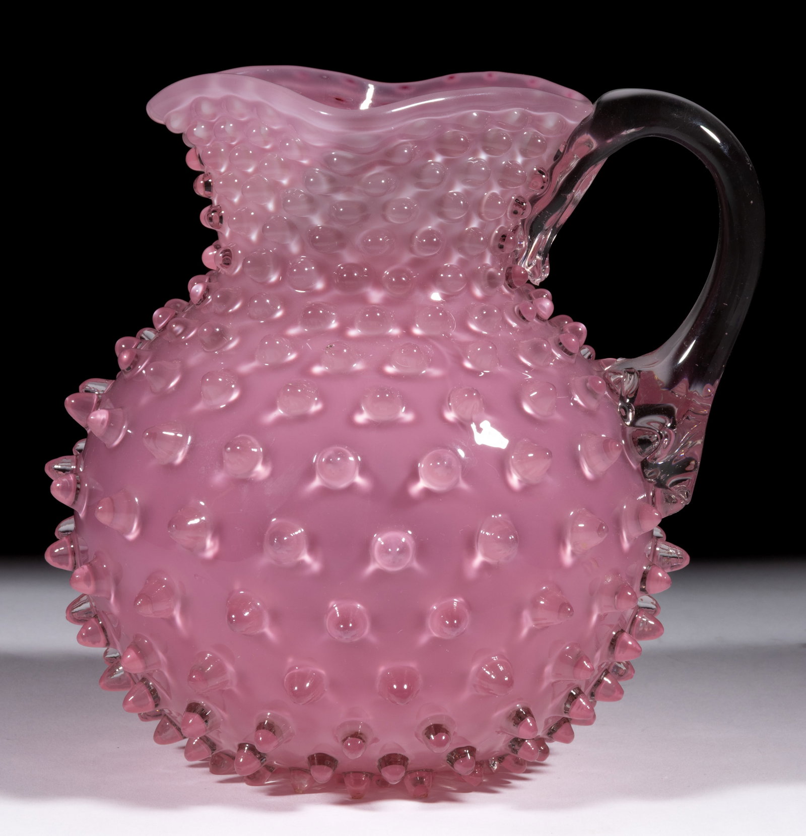 HOBBS NO. 323 DEW DROP / HOBNAIL NO. 5 JUG / PITCHER: HOBBS NO. 323 DEW DROP / HOBNAIL NO. 5 JUG / PITCHER, glossy pink Richelieu, with square rim, applied colorless handle, and polished pontil mark. Hobbs, Brockunier & Co. Pattern introduced in 1886