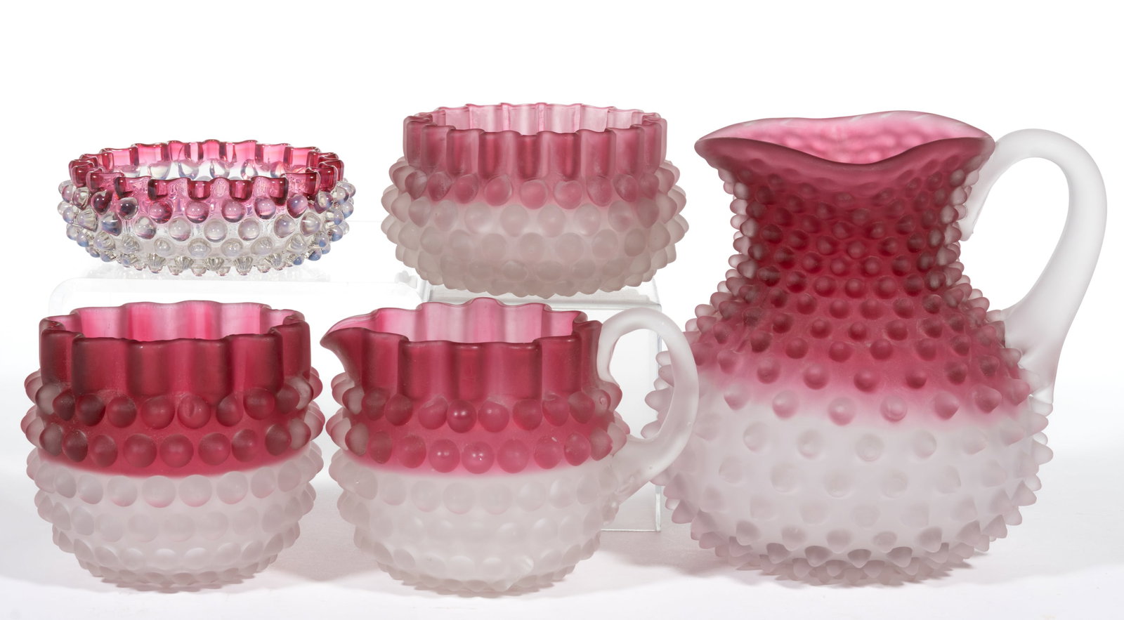 HOBBS NO. 323 DEW DROP / HOBNAIL ARTICLES, LOT OF FIVE: HOBBS NO. 323 DEW DROP / HOBNAIL ARTICLES, LOT OF FIVE, comprising a frosted rubina pitcher with applied frosted handle, a creamer with applied frosted handle, a spooner, a finger bowl, and an opalesc