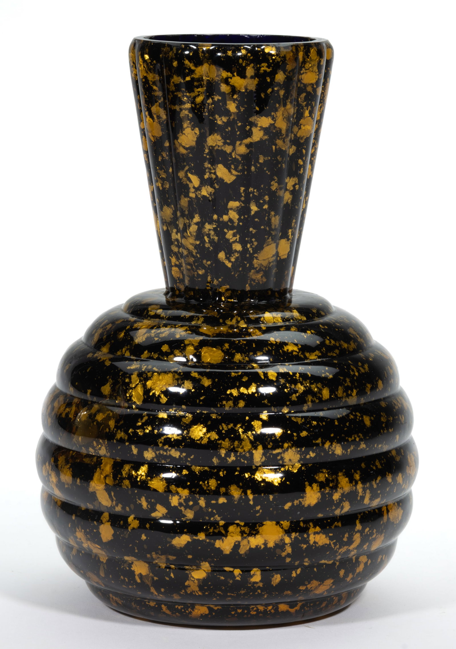 HOBBS SPANGLED WARE WATER BOTTLE: HOBBS SPANGLED WARE WATER BOTTLE, deep blue cased amber colored mica flakes, spherical beehive-form body with conical ribbed neck. Hobbs, Brockunier & Co. Circa 1883. 8 1/2" H. Provenance: Fr