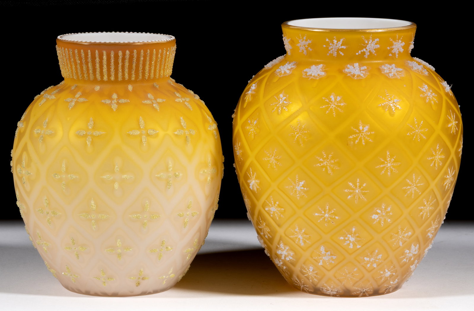 VICTORIAN AIR-TRAP MOTHER-OF-PEARL CORALENE-DECORATED SATIN GLASS VASES, LOT OF TWO: VICTORIAN AIR-TRAP MOTHER-OF-PEARL CORALENE-DECORATED SATIN GLASS VASES, LOT OF TWO, shaded butterscotch, one urn-form with Cross and Diamond pattern highlighted with coralene decoration on the body a
