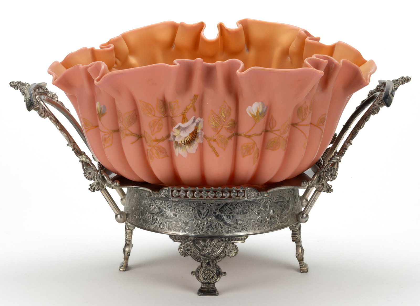 VICTORIAN SATIN ART GLASS BRIDE'S BASKET: VICTORIAN SATIN ART GLASS BRIDE'S BASKET, peach with polychrome-enamel and gilt floral decoration, 24-lobe form with ruffled-rim, polished pontil mark, fitted in a quadruple-plated stand