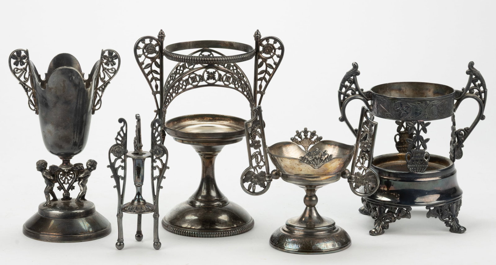 ASSORTED SILVER-PLATED VASE / OTHER STANDS, LOT OF FIVE: ASSORTED SILVER-PLATED VASE / OTHER STANDS, LOT OF FIVE, each having openwork foliate decoration; including a number "01312" by F.B. Rogers Silver Co. of Shelburne Falls (active 1883-18