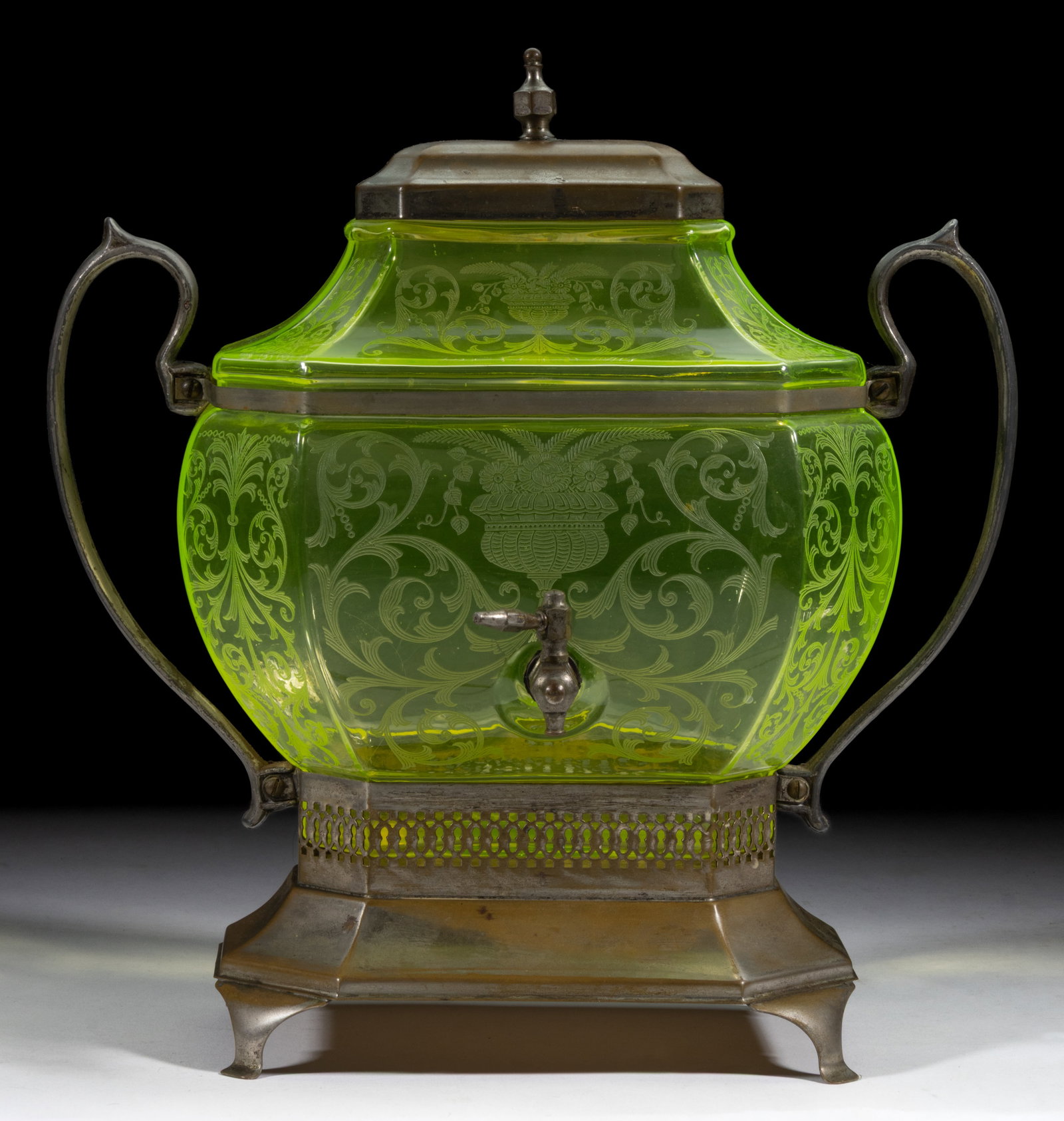 CAMBRIDGE ETCHED SAMOVAR: CAMBRIDGE ETCHED SAMOVAR, Vaseline (reacts under black light), with scrolling etched decoration with centered floral arrangement, factory polished rim, fitted in a silver-plated stand marked &quo