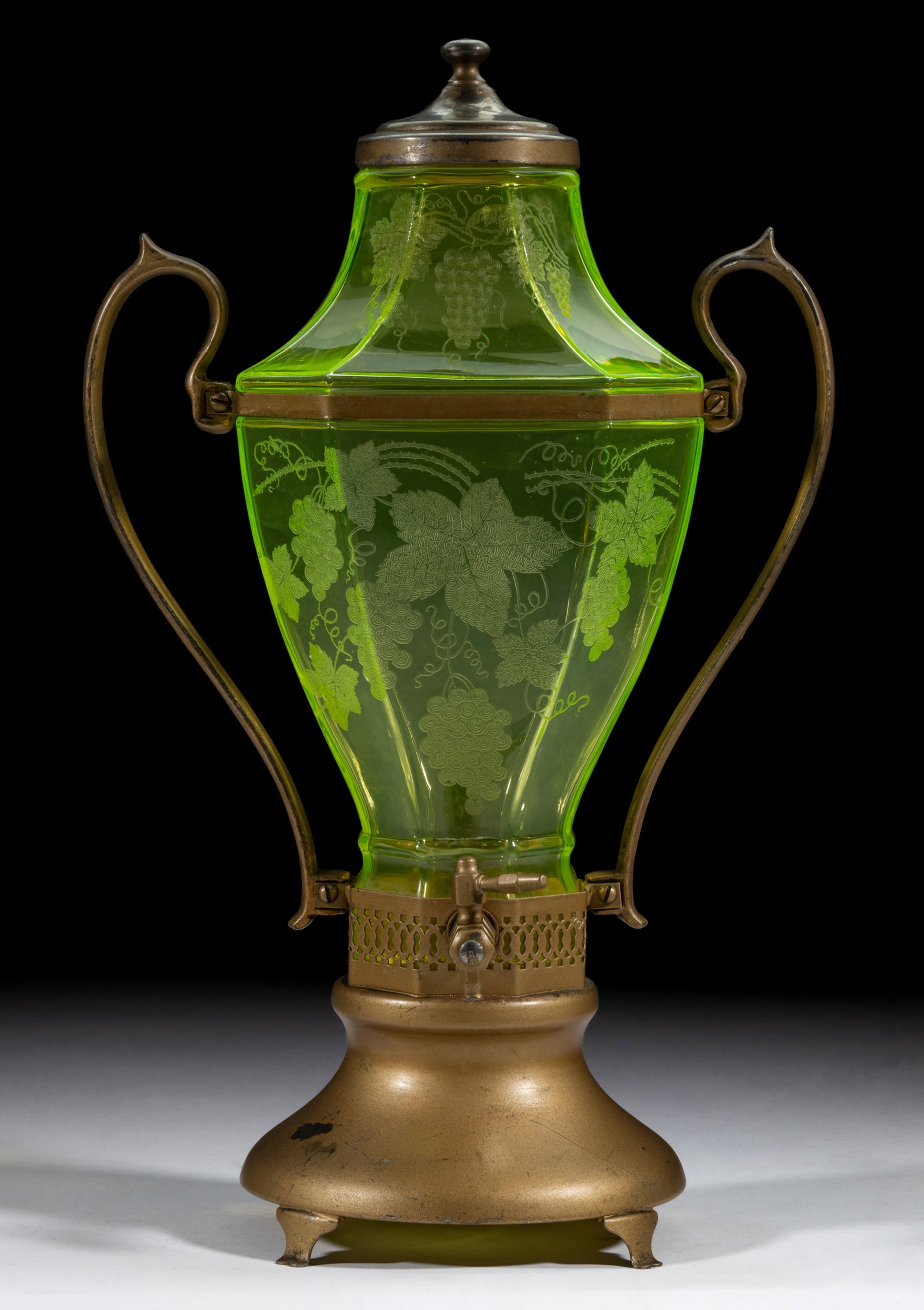 CAMBRIDGE ETCHED SAMOVAR: CAMBRIDGE ETCHED SAMOVAR, Vaseline (reacts under black light), with a grapevine etched design, factory-polished rim, fitted in a silver-plated stand marked "CENTURY / SILVER PLATE".&nbs