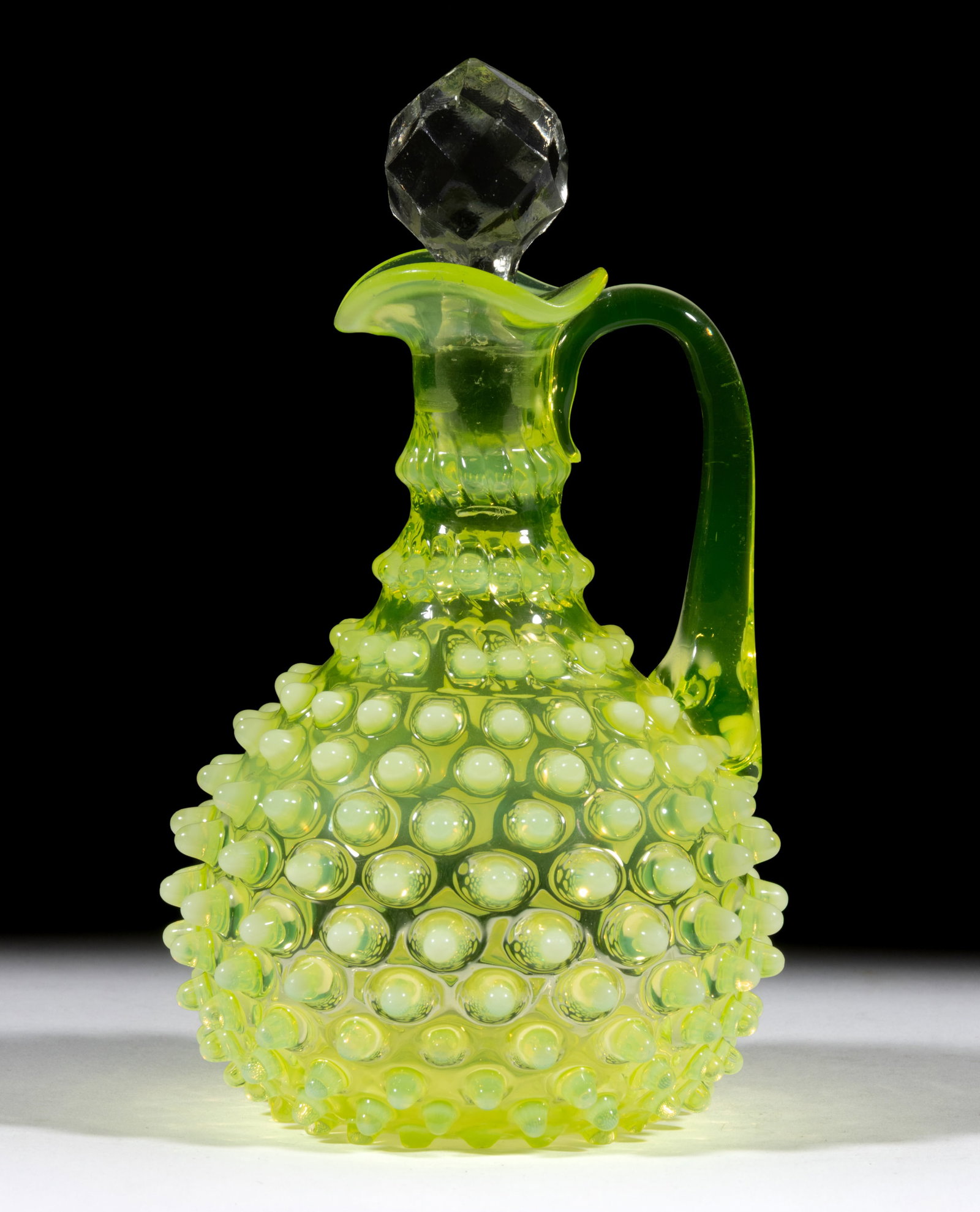 HOBBS NO. 323 DEW DROP / HOBNAIL CRUET: HOBBS NO. 323 DEW DROP / HOBNAIL CRUET, Vaseline (reacts under black light) opalescent, with applied handle, and colorless cut-facet stopper, polished pontil mark. Hobbs, Brockunier & Co. Circa 18