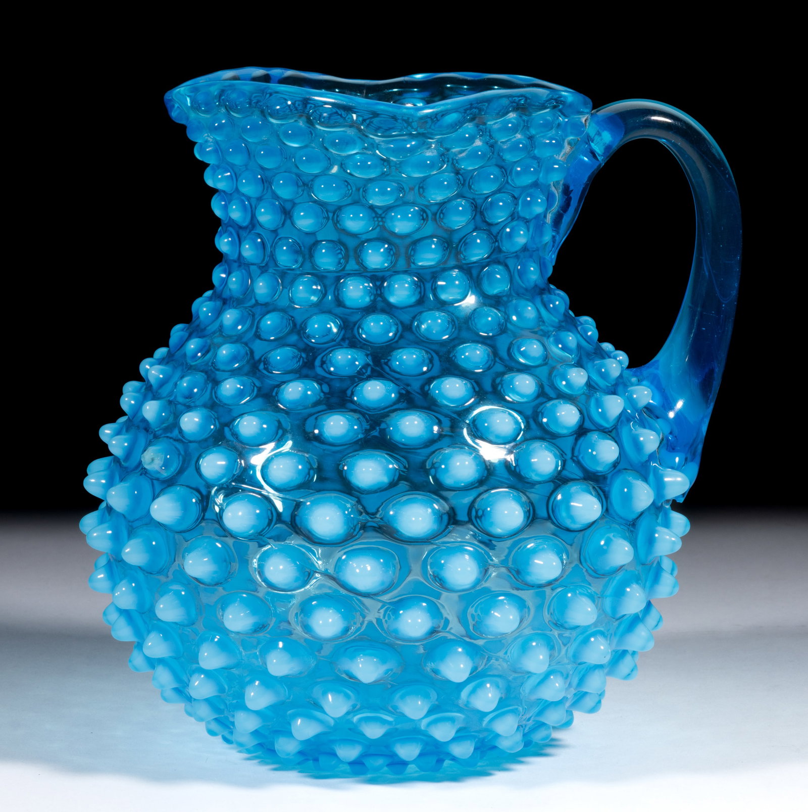 HOBBS NO. 323 DEW DROP / HOBNAIL NO. 5 JUG / PITCHER: HOBBS NO. 323 DEW DROP / HOBNAIL NO. 5 JUG / PITCHER, blue/sapphire opalescent, large-size square rim, applied handle, polished pontil mark. Hobbs, Brockunier & Co. Pattern introduced 1886. 7 3/4&
