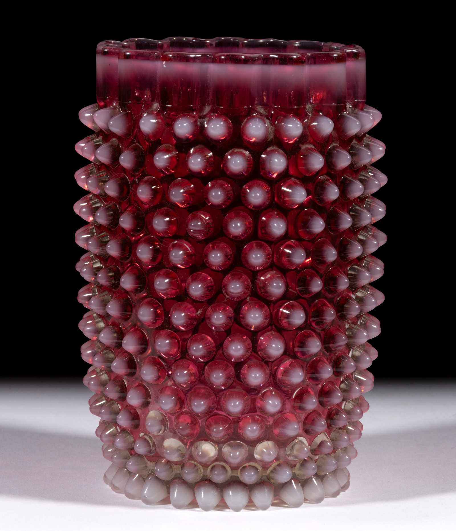 HOBBS NO. 323 DEW DROP / HOBBS HOBNAIL CELERY VASE: HOBBS NO. 323 DEW DROP / HOBBS HOBNAIL CELERY VASE, cranberry opalescent, with ruffled rim. Hobbs, Brockunier & Co. Circa 1886. 6" H. Literature: Parallels The Bredehofts - Hobbs, Brock